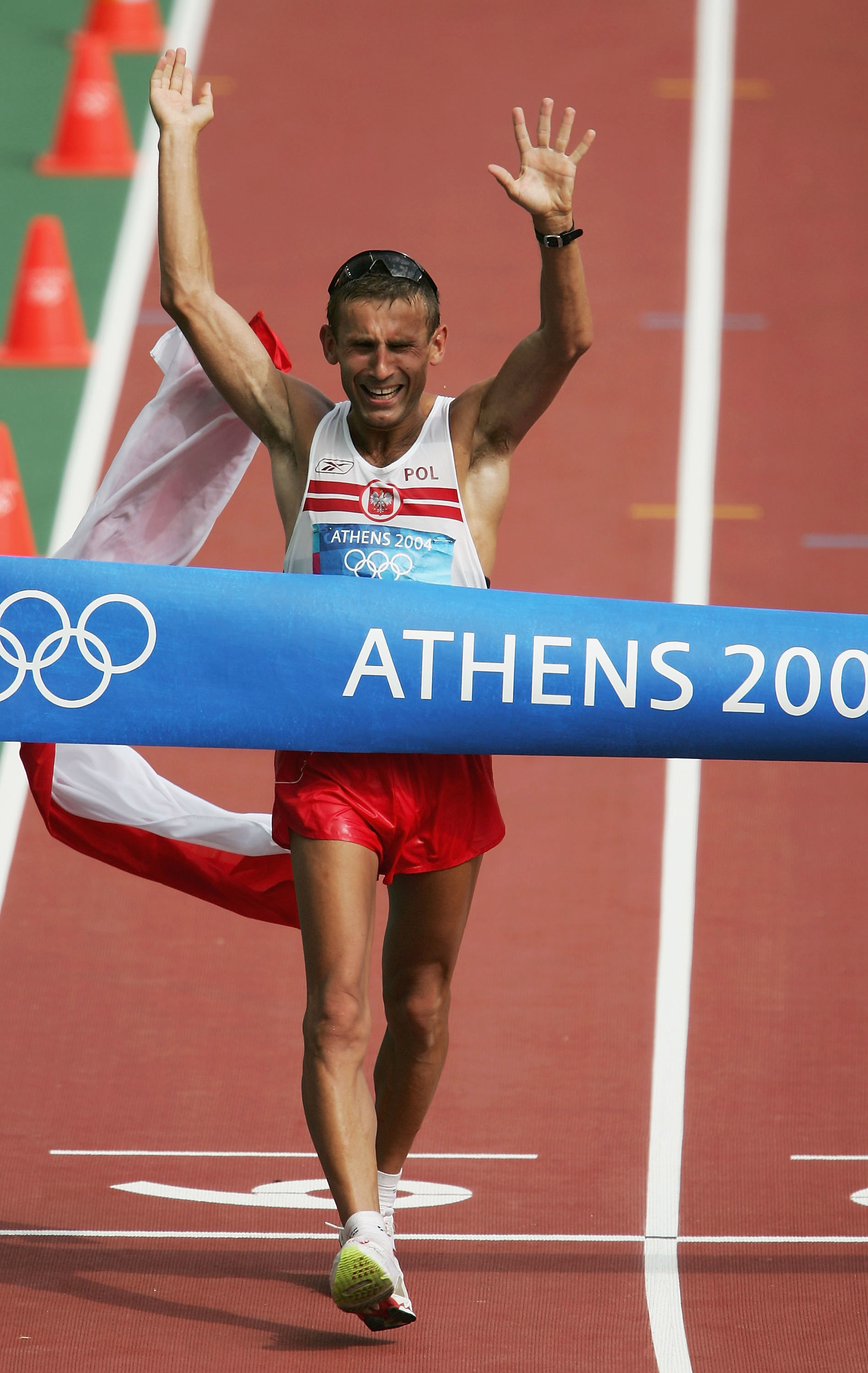 Athlete Robert Korzeniowski crossing the finish line.