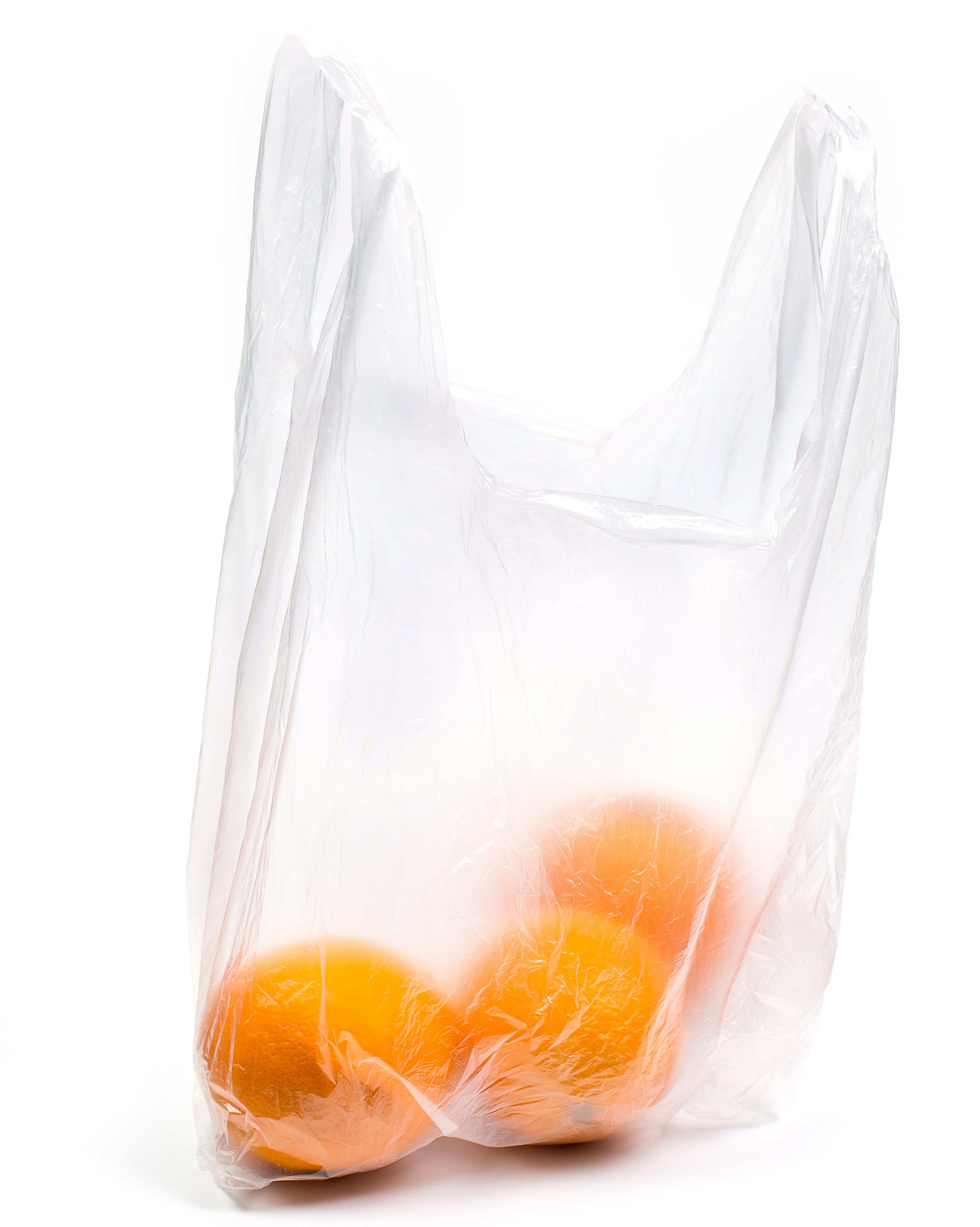 Plastic bag containing three oranges