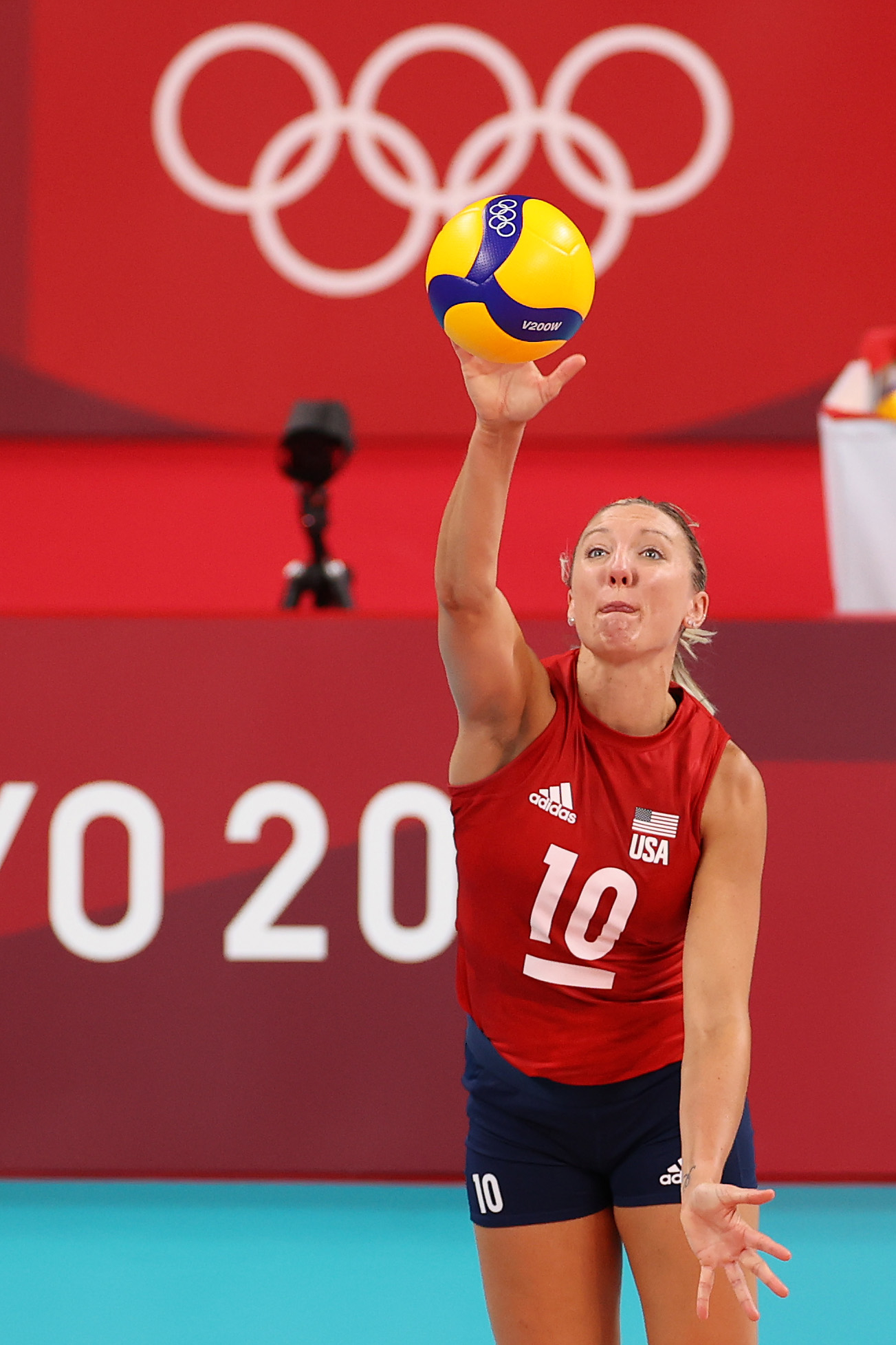 USA volleyball player, Jordan Larson, wearing a jersey numbered 10, serving the ball during the Tokyo 2020 Olympics