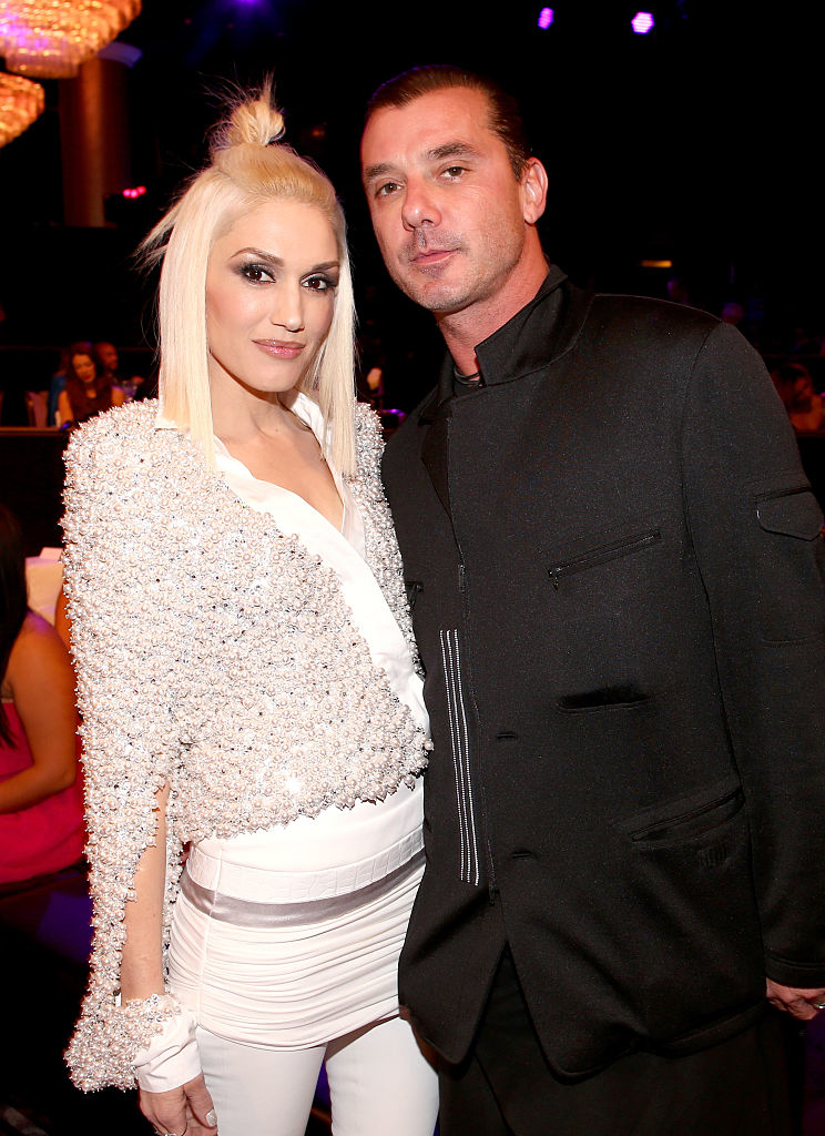 Gwen Stefani in a sparkly jacket and Gavin Rossdale in a black suit pose together at a formal event