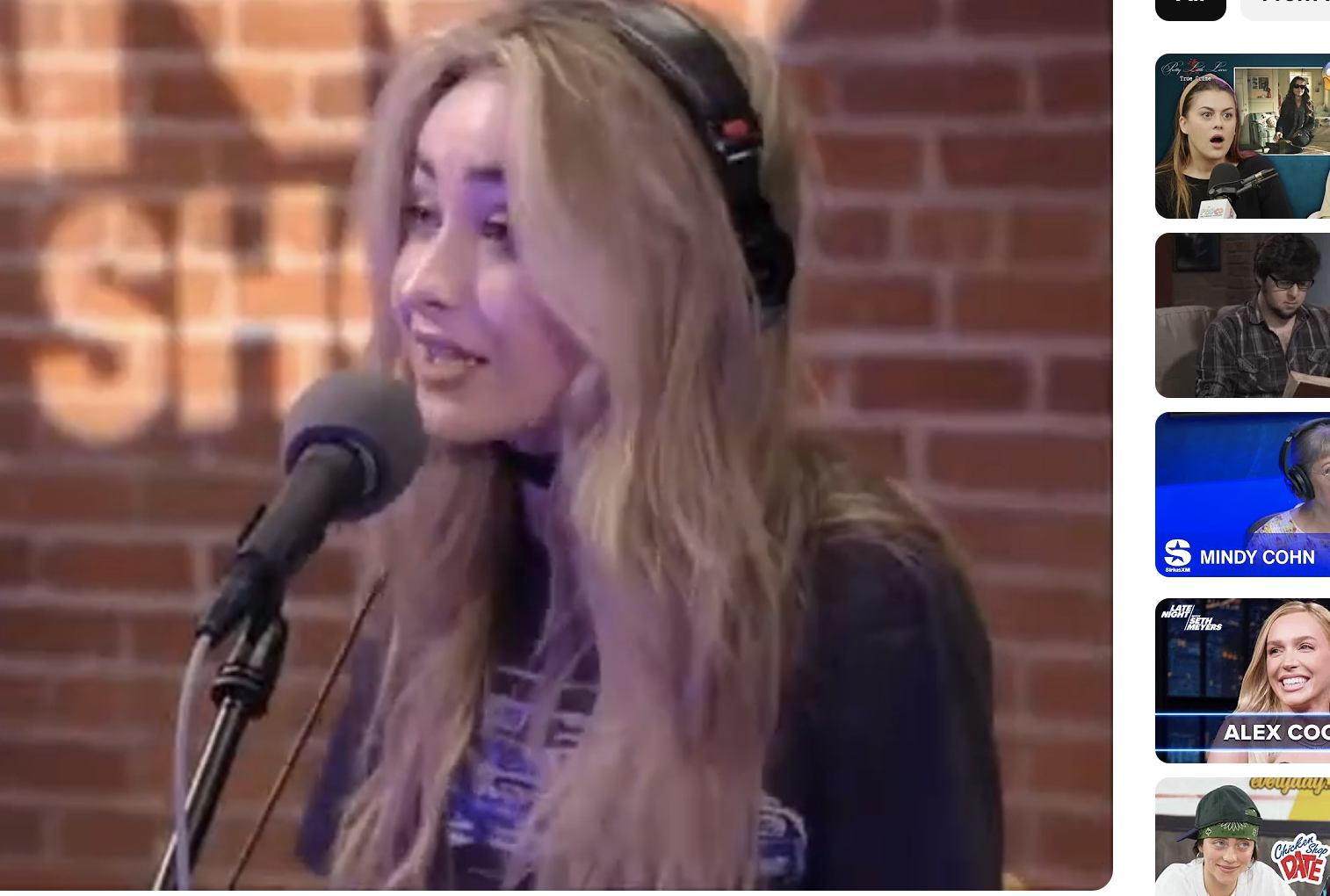 Sabrina Carpenter wears headphones and speaks into a microphone during an interview with Zach Sang on his talk show