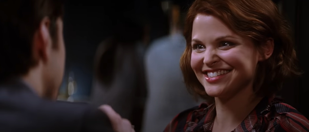 Ginnifer Goodwin smiles brightly at a man in the scene from the movie &quot;He's Just Not That Into You&quot;