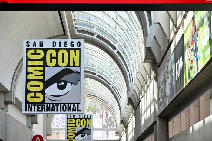 Comic-Con International signage inside a large convention center with an arched glass roof in San Diego