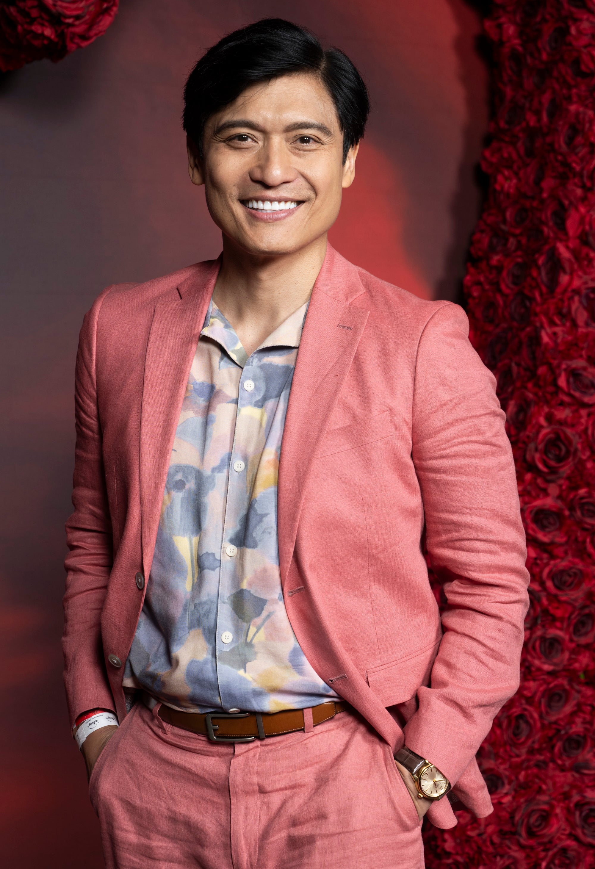 Paolo Montalban on the red carpet for "Descendants: The Rise of Red" in a salmon suit