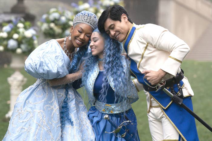 Brandy, Malia Baker, and Paolo Montalban hugging in a scene from "Descendants: The Rise of Red"