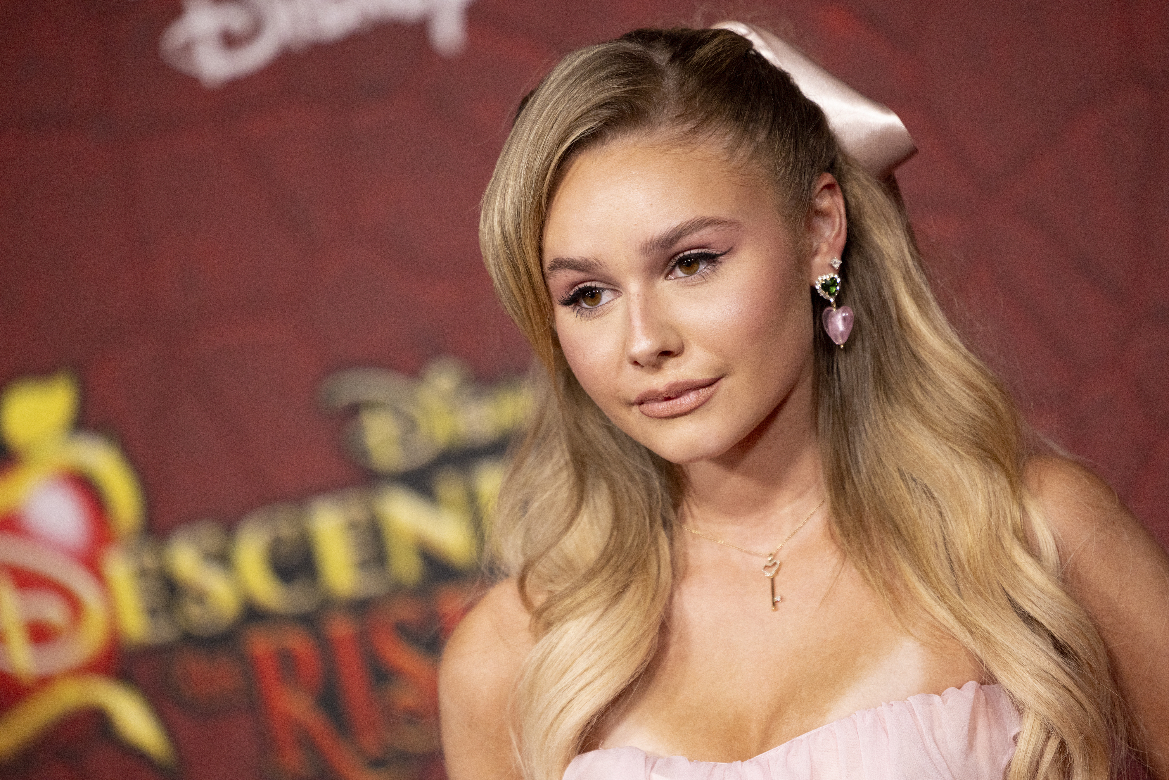 Ruby Rose Turner on the red carpet for "Descendants: The Rise of Red" in a blush strapless dress