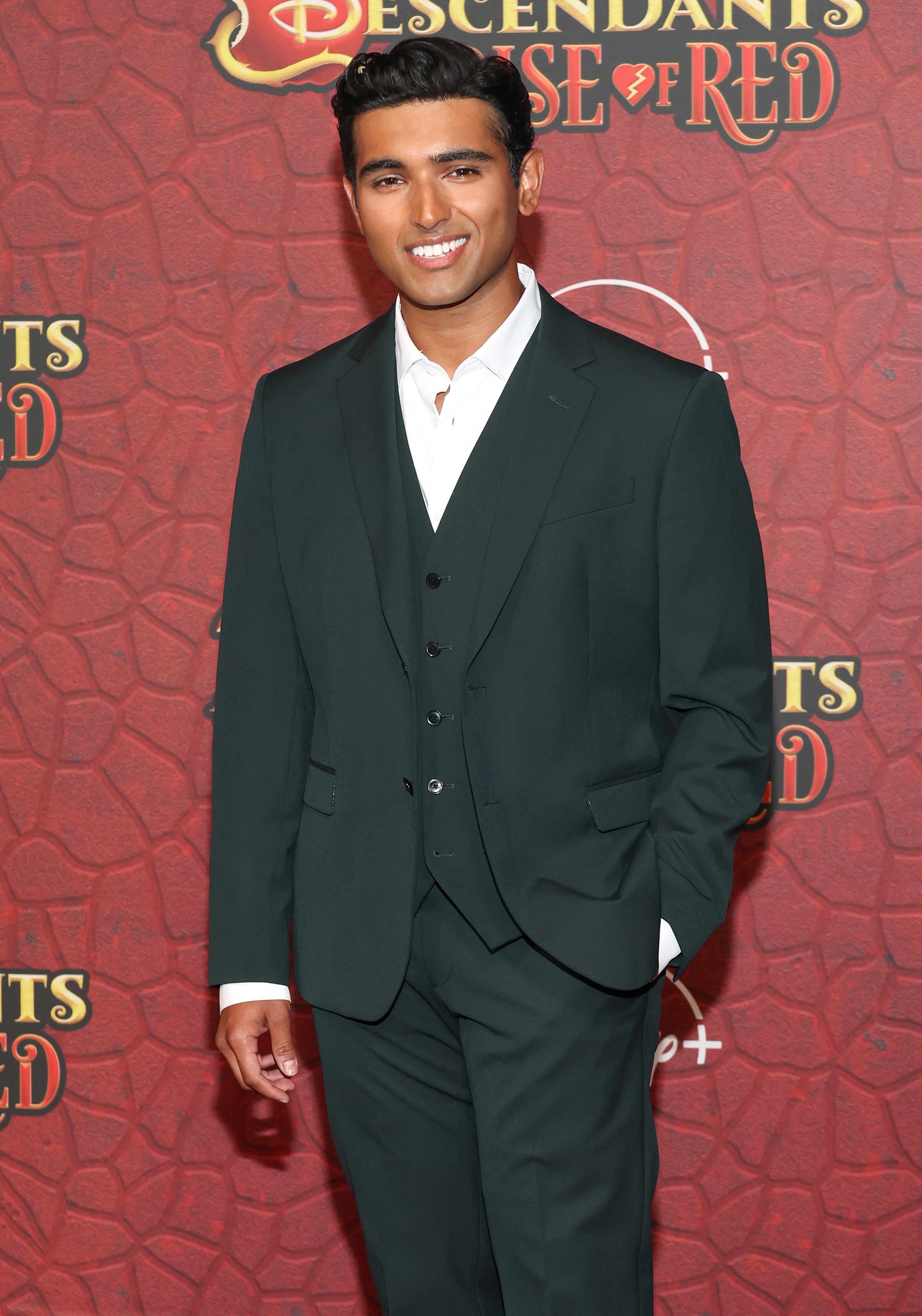 Kabir Bery on the red carpet for "Descendants: The Rise of Red" in a suit