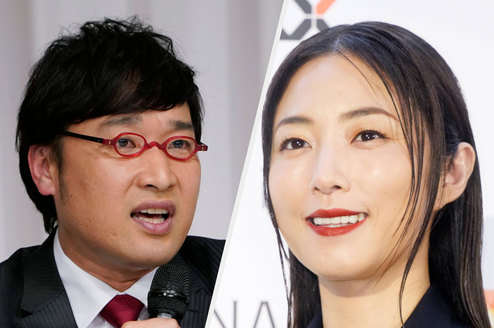 メガネをかけた男性と笑顔の女性が並んで写っています。