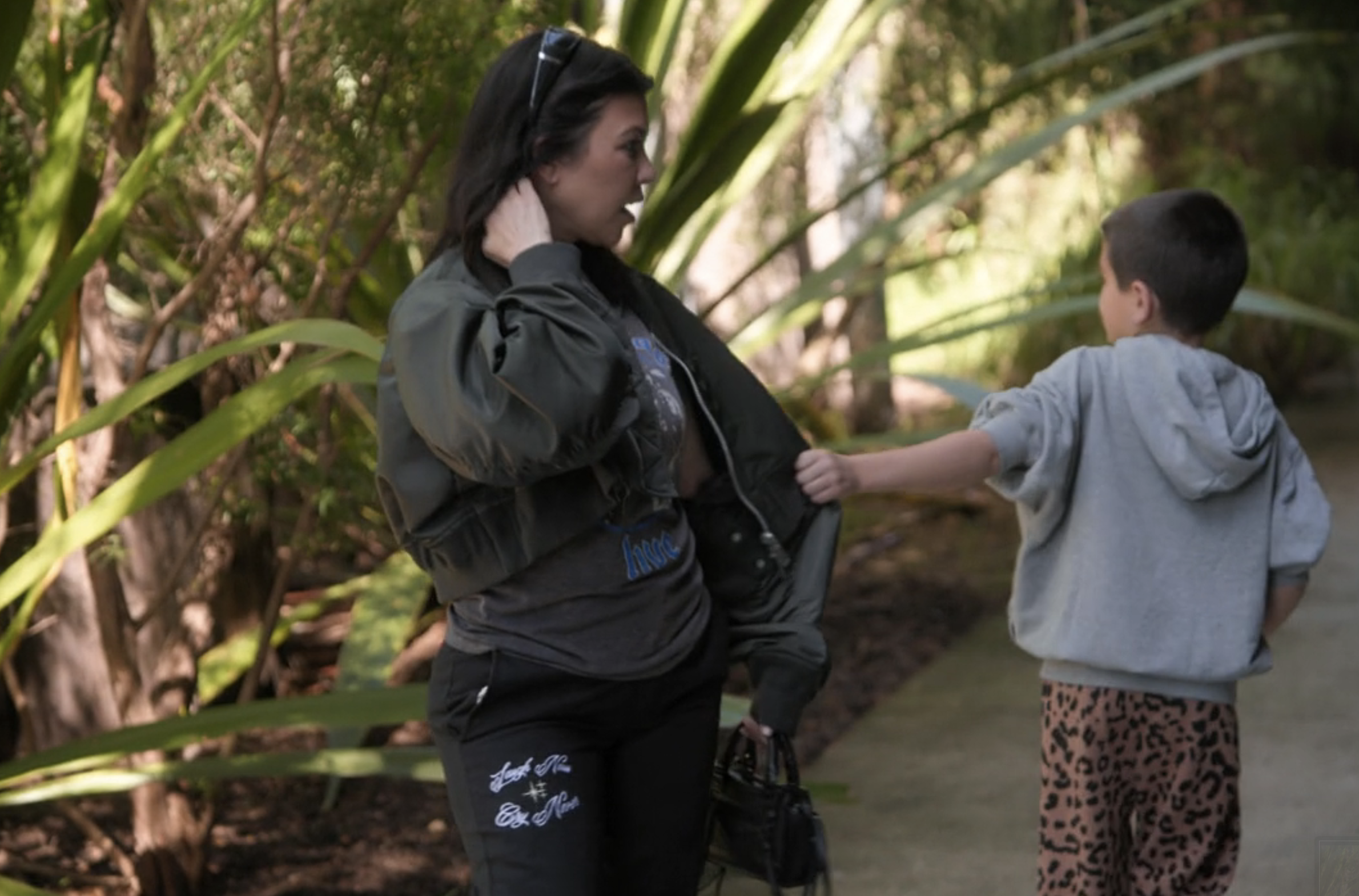 Reign grabbing his mother, Kourtney Kardashian&#x27;s, jacket to lead her away