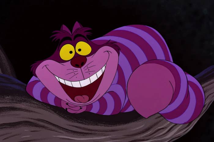Cheshire Cat from "Alice in Wonderland" grinning broadly while lounging on a tree branch