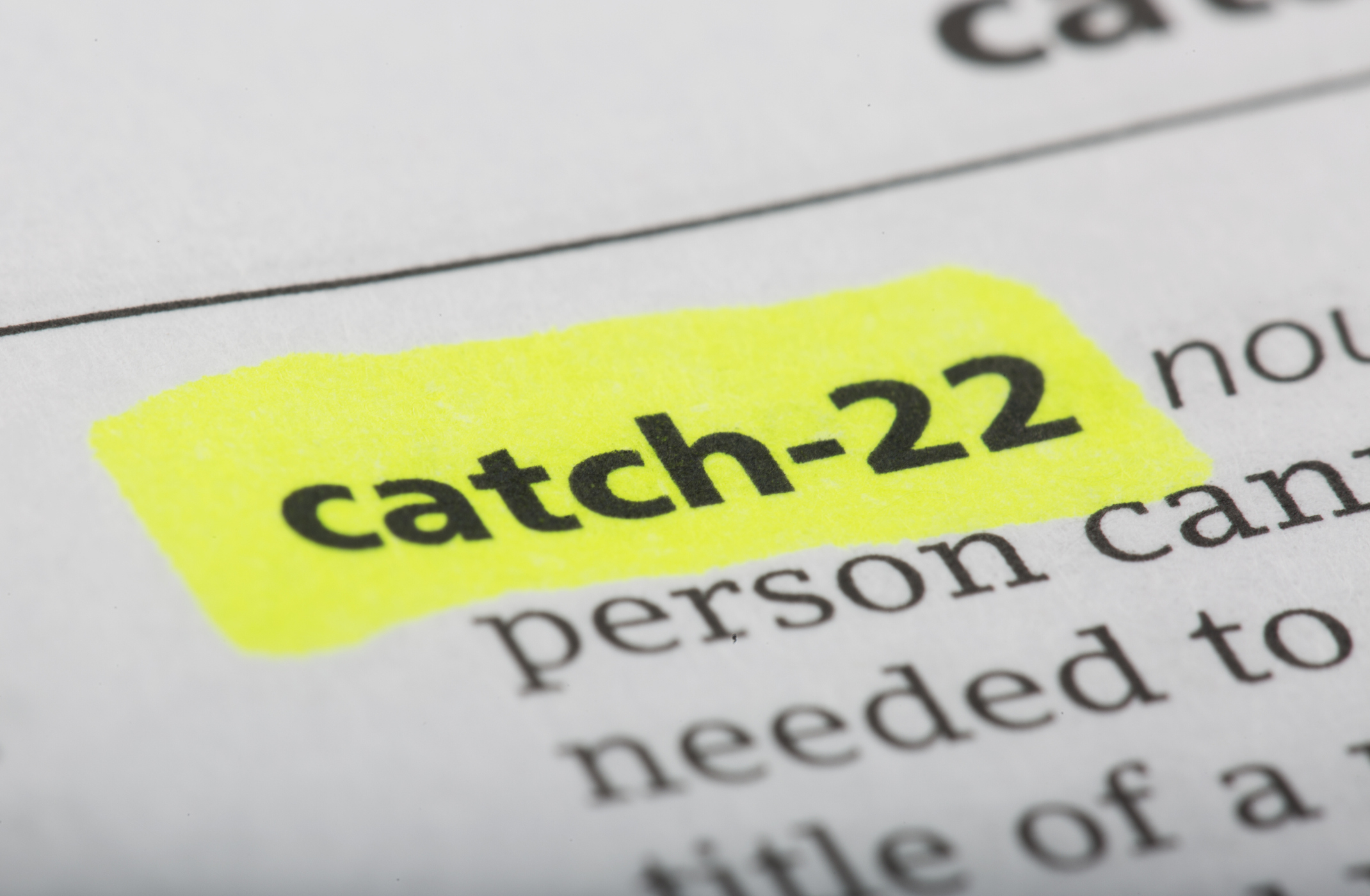 Highlighted text "catch-22" in a dictionary entry. The term is prominently showcased amid other text