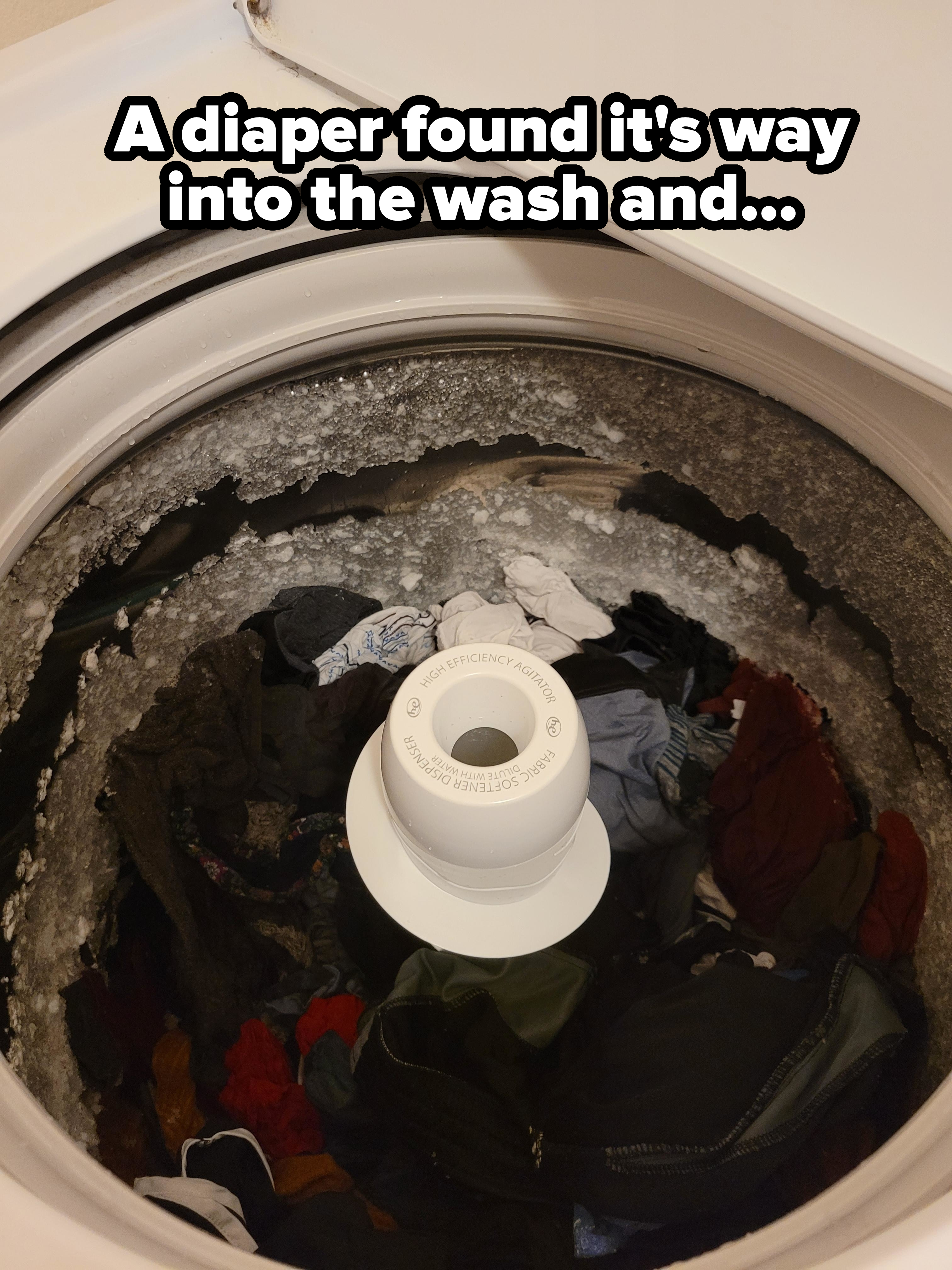 A washing machine filled with clothes has frozen over, showing ice buildup around the drum