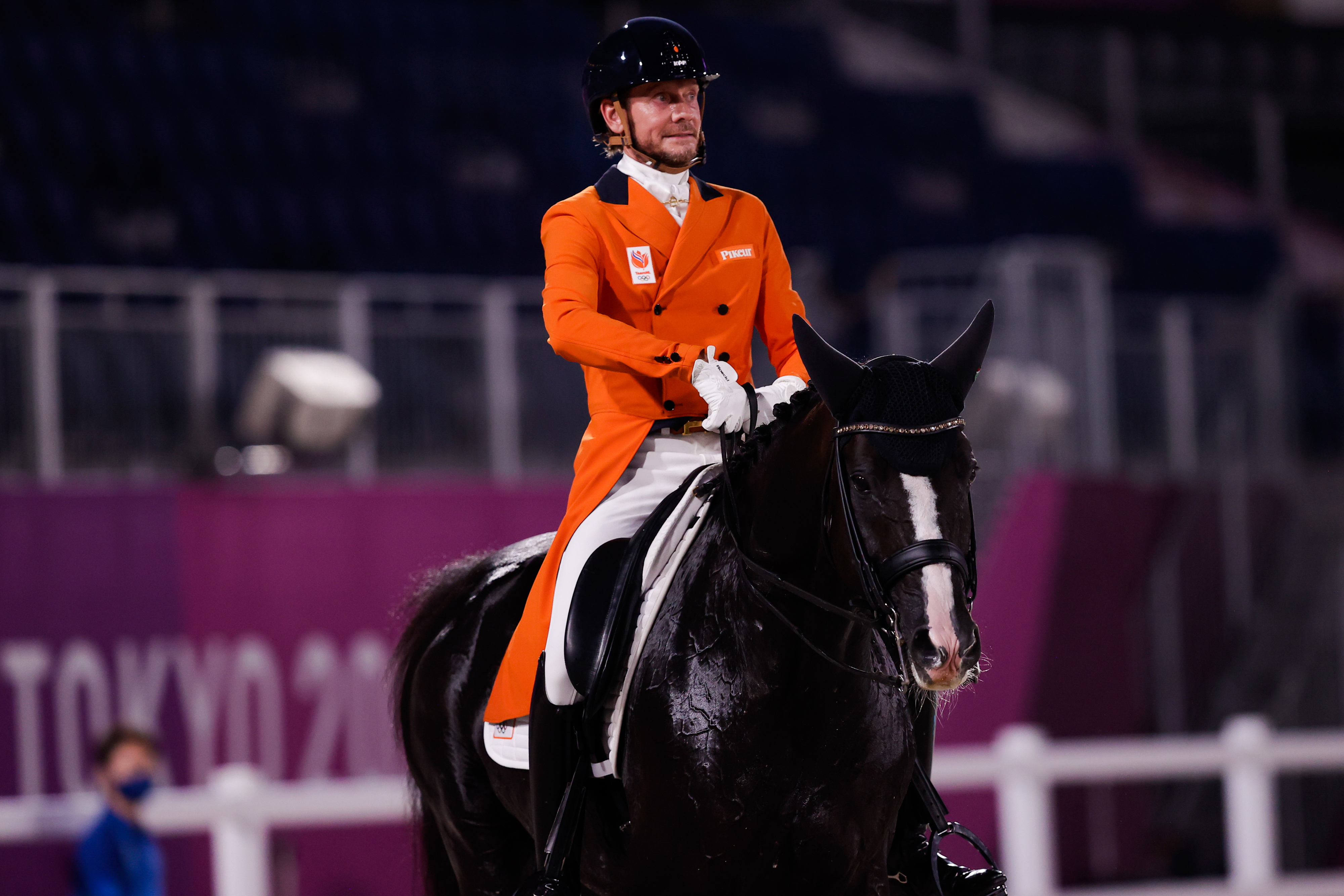 Para-equestrian athlete, Sanne Voets, riding a horse during a competition at the Tokyo 2020 Paralympic Games
