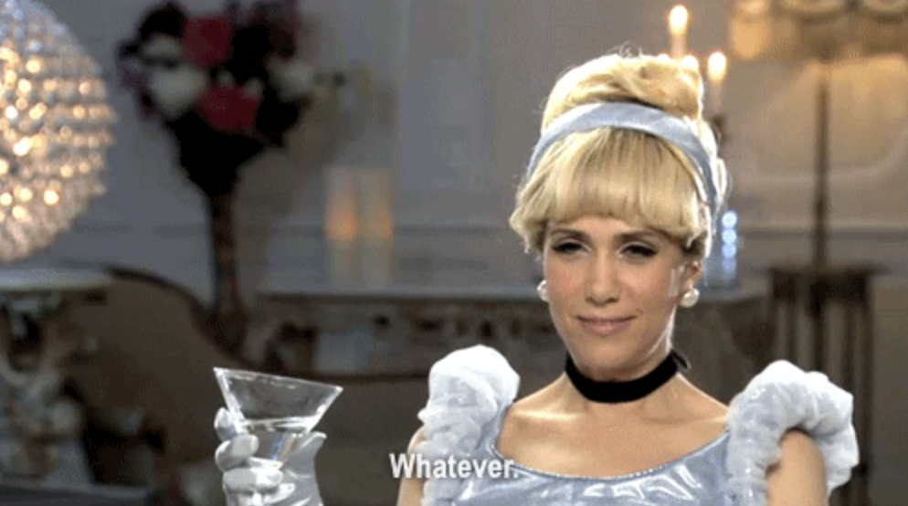 Kristen Wiig dressed as Cinderella, holding a martini glass, with the caption "Whatever."