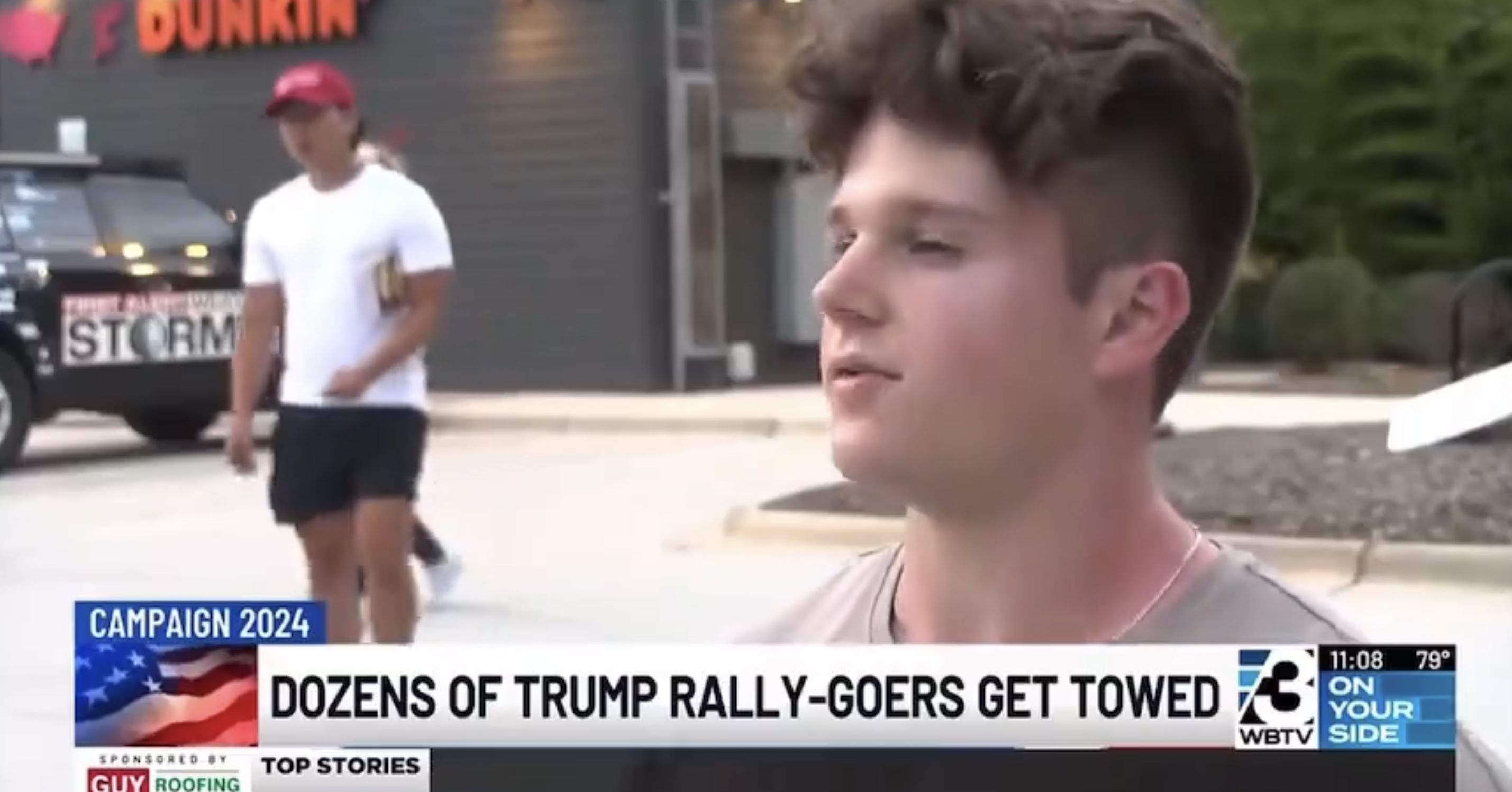 Image showing a news broadcast with a lower-third headline reading, &quot;Dozens of Trump rally-goers get towed.&quot; A young man is speaking on camera. Background shows a Dunkin' store