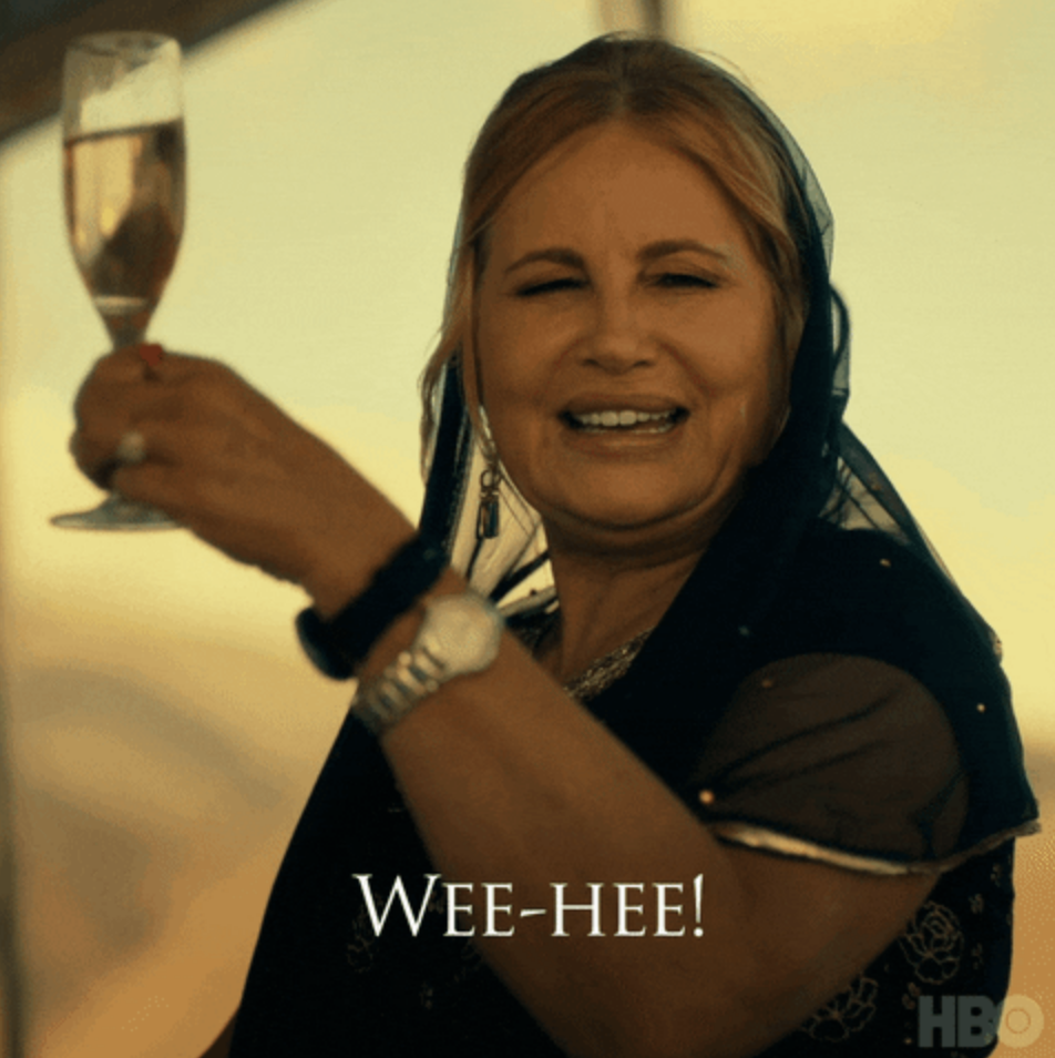 Person raising a champagne glass and smiling, saying "WEE-HEE!" with HBO logo in the corner