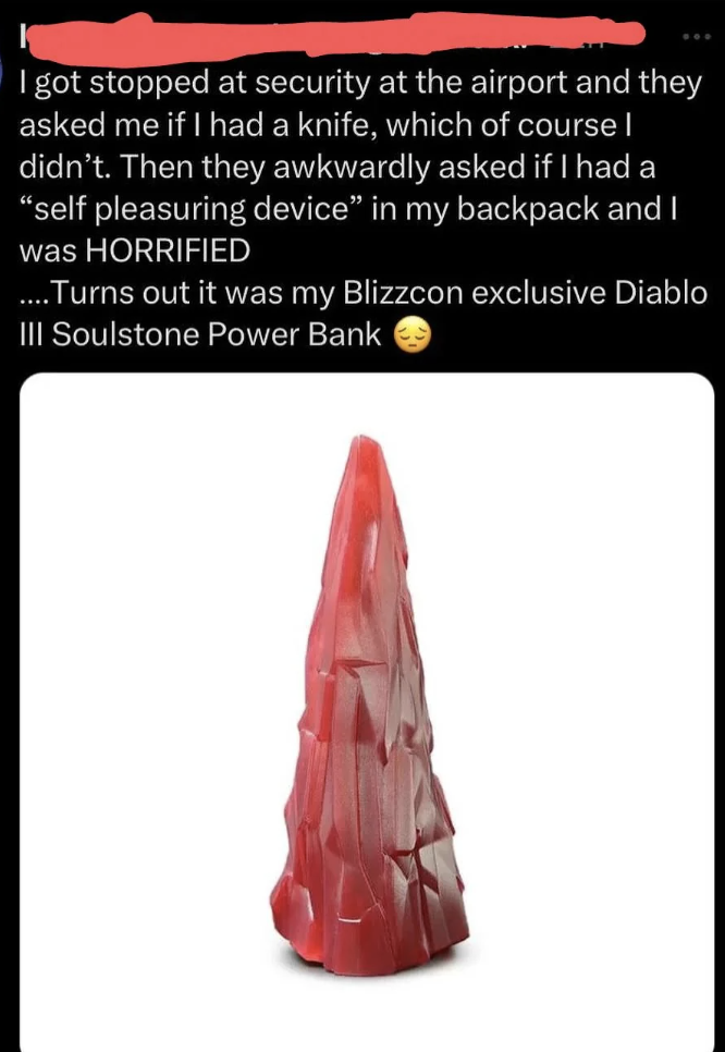 Summary of the text in the image: The text recounts an experience where the person was stopped by airport security, questioned about carrying a knife and a "self pleasuring device," later discovering it was a Diablo III Soulstone Power Bank from BlizzCon