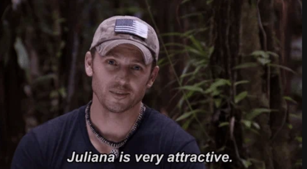 A person wearing a camouflage hat with an American flag patch and a necklace says, "Juliana is very attractive." Background has lush, green vegetation