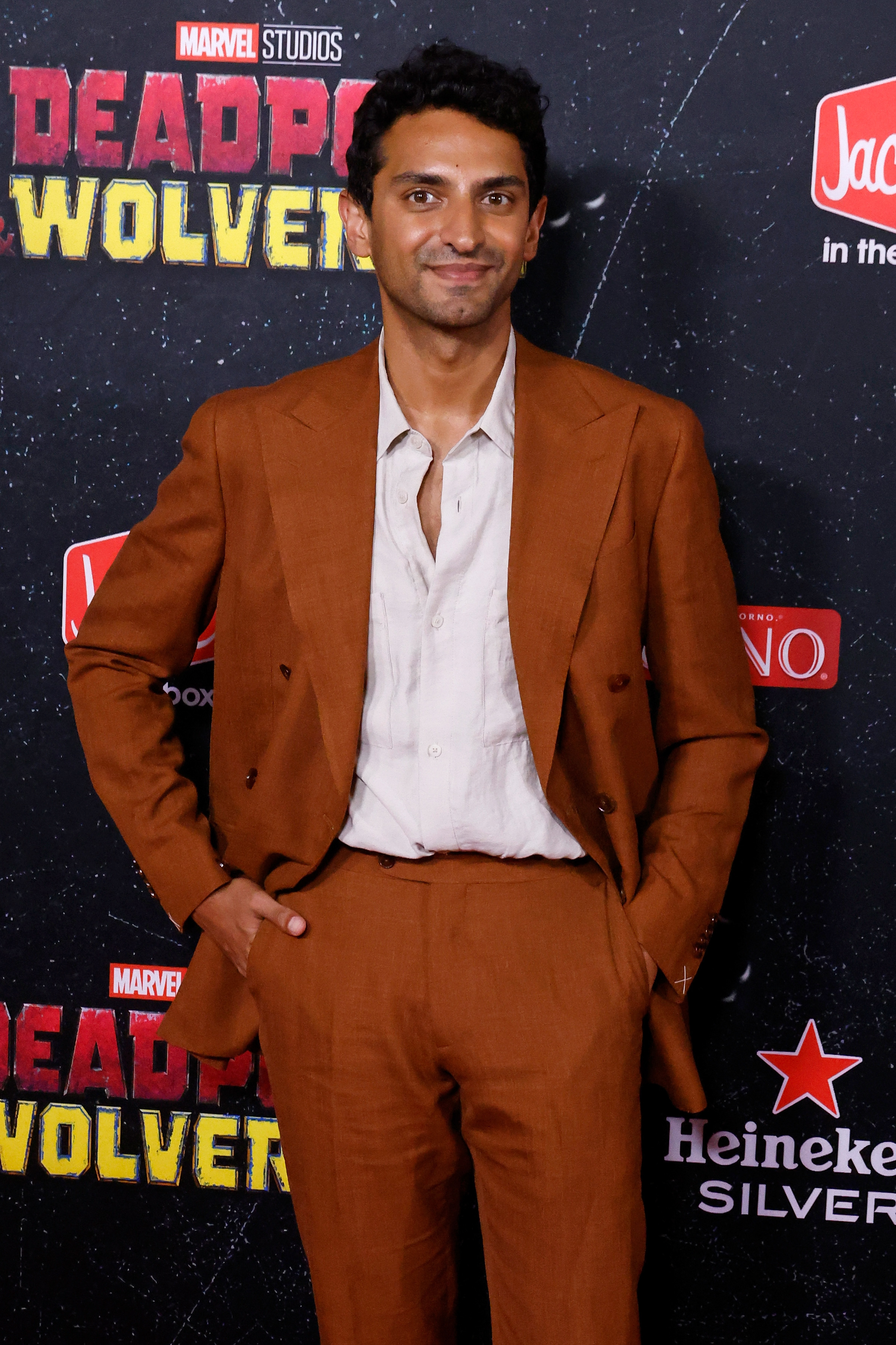 Karan Soni in a suit at the &quot;Deadpool &amp;amp; Wolverine&quot; world premiere