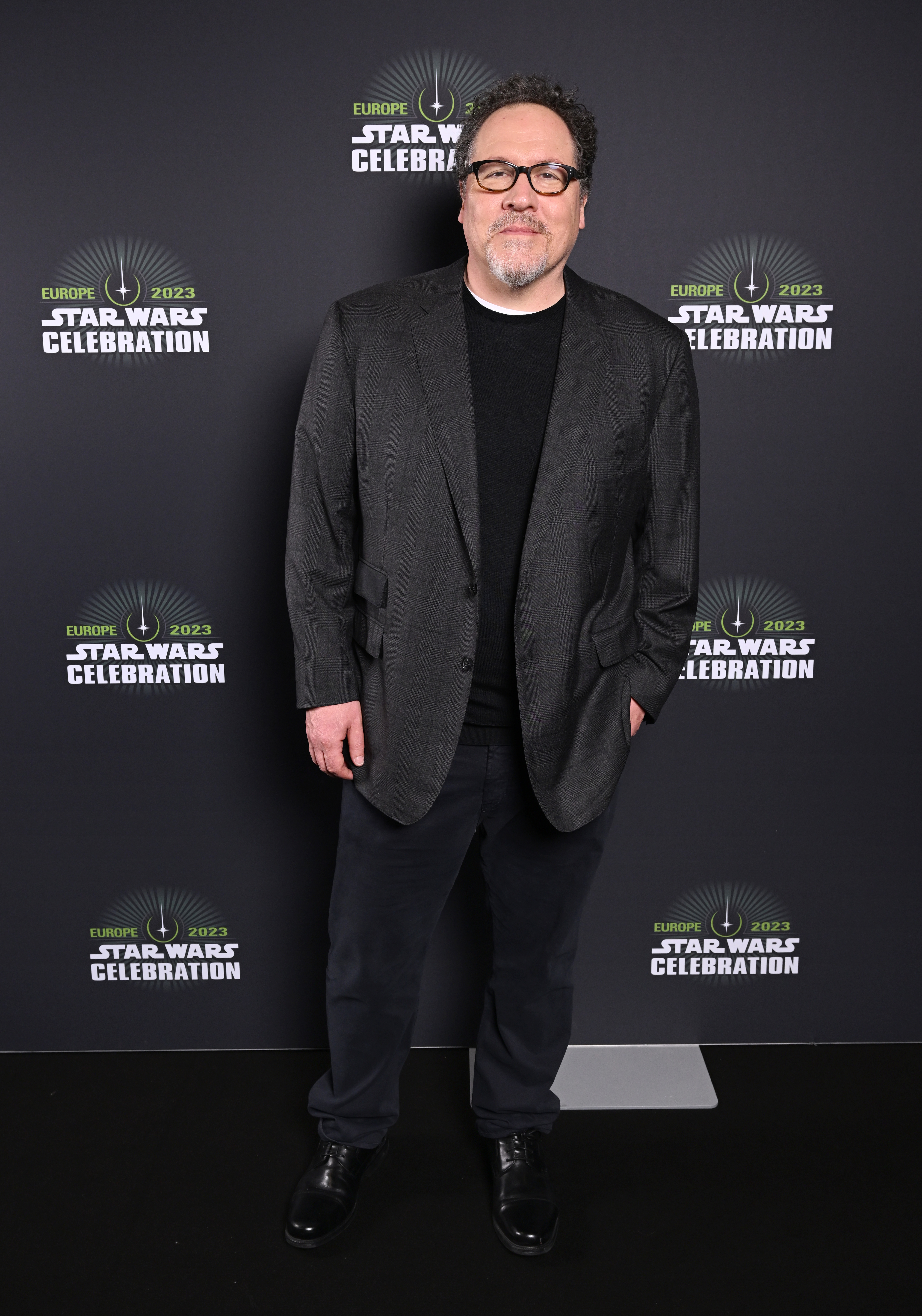 Jon Favreau in a black suit at the Star Wars Celebration 2023 in London, England