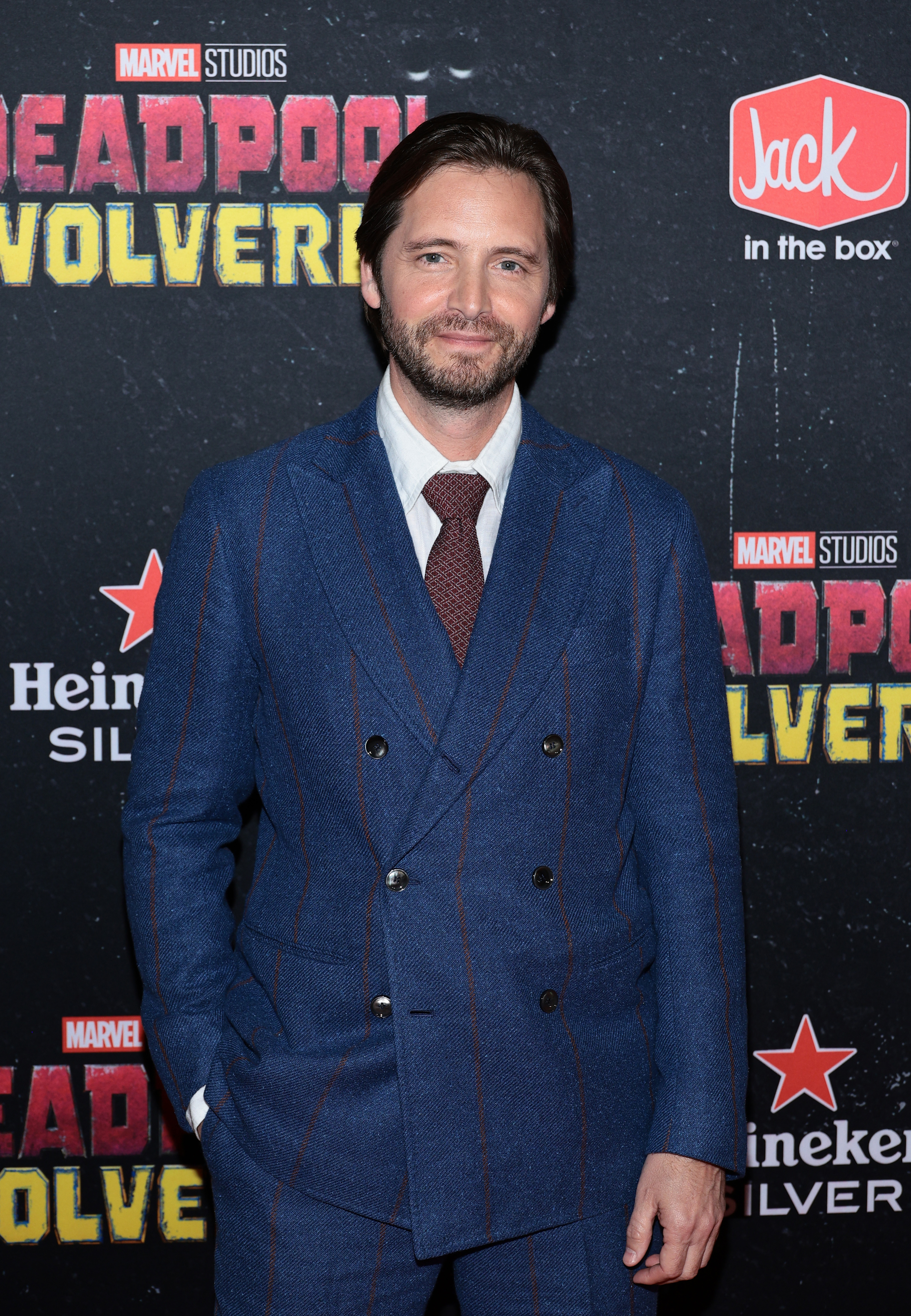 Aaron Stanford in a blue suit at the &quot;Deadpool &amp;amp; Wolverine&quot; world premiere
