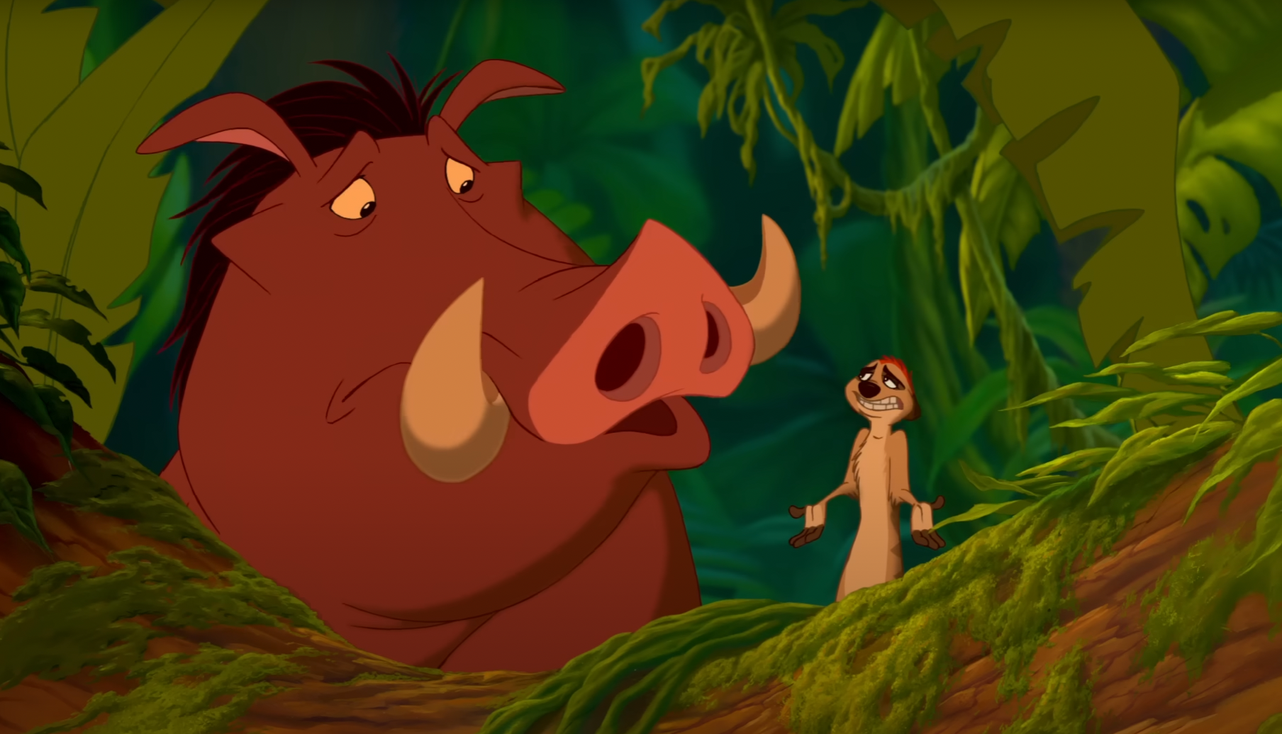 Pumbaa and Timon from The Lion King share a concerned look in a jungle scene. Pumbaa appears worried while Timon gestures with a serious expression