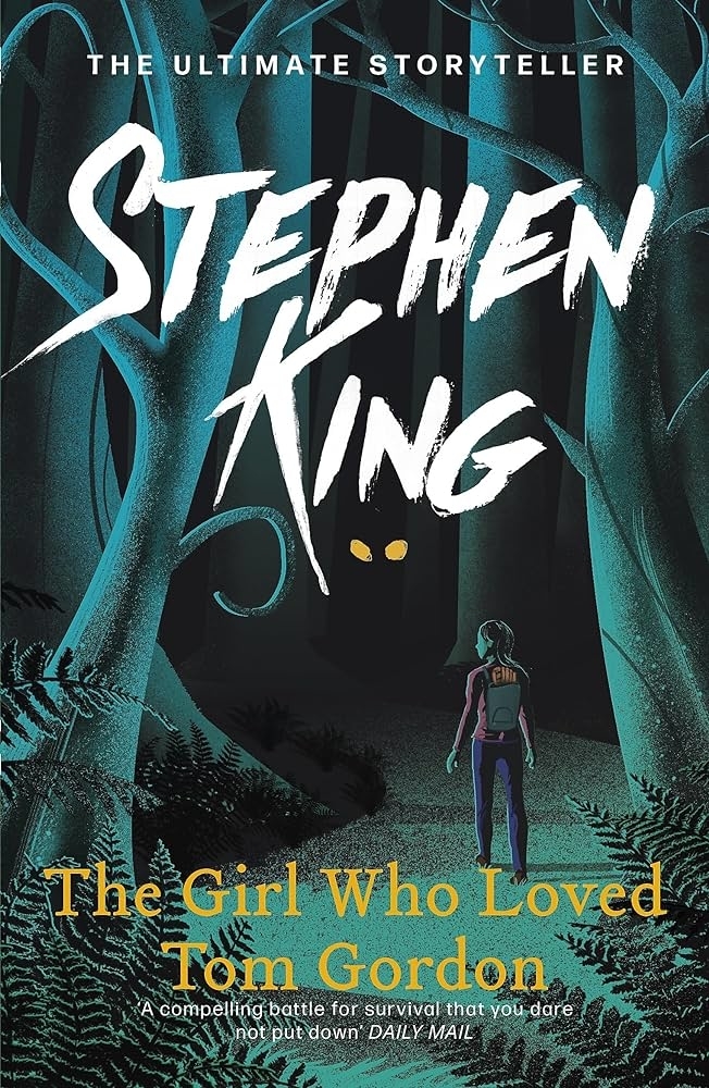Book cover of "The Girl Who Loved Tom Gordon" by Stephen King features a girl with a backpack in a dark, eerie forest. Text: "A compelling battle for survival that you dare not put down" - Daily Mail