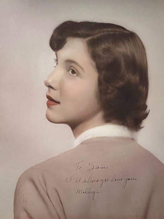 Portrait of a woman looking over her shoulder with a short hairstyle. Text on image: &quot;To Sam, I always love you. Mollie.&quot;