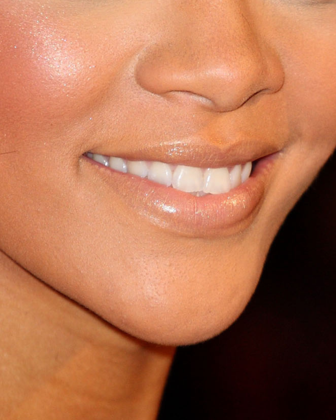 A close-up of Rihanna's pale concealer coated lips