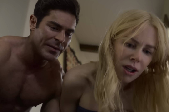 Zac Efron and Nicole Kidman appear in a dramatic scene from a movie, both focused and expressive