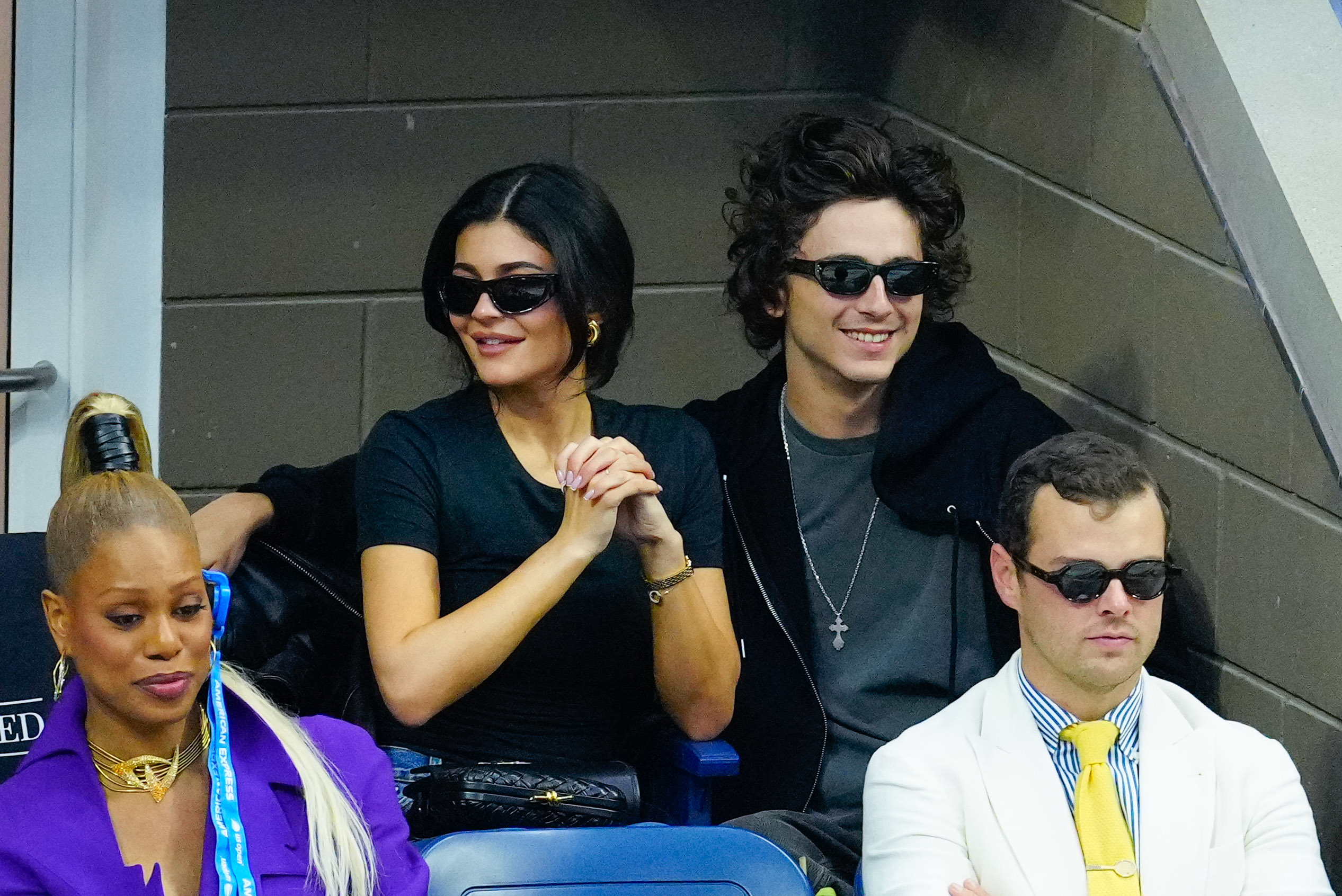 Laverne Cox, Kylie Jenner, Timothée Chalamet, and an unidentified person sitting near each at a sports event