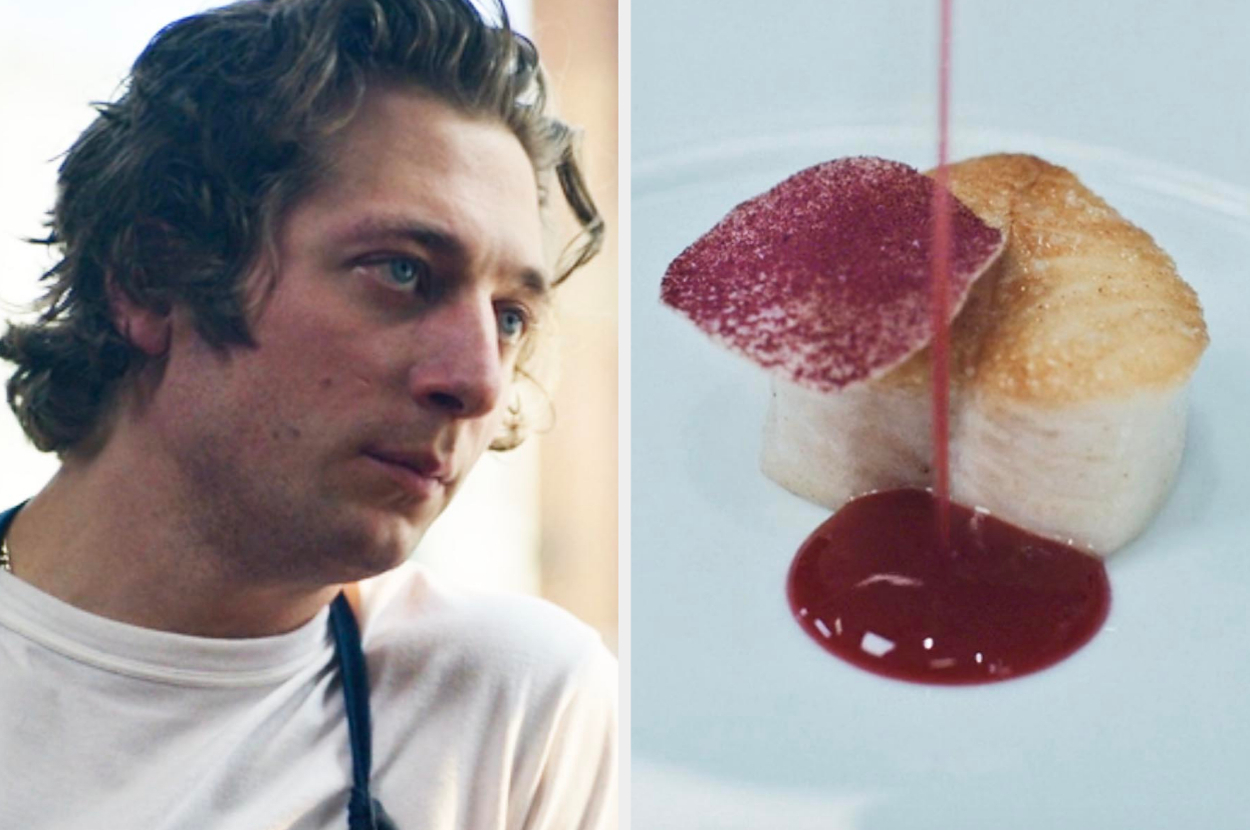 Close-up of Jeremy Allen White wearing a white shirt with black apron, next to plated gourmet fish dish with red sauce