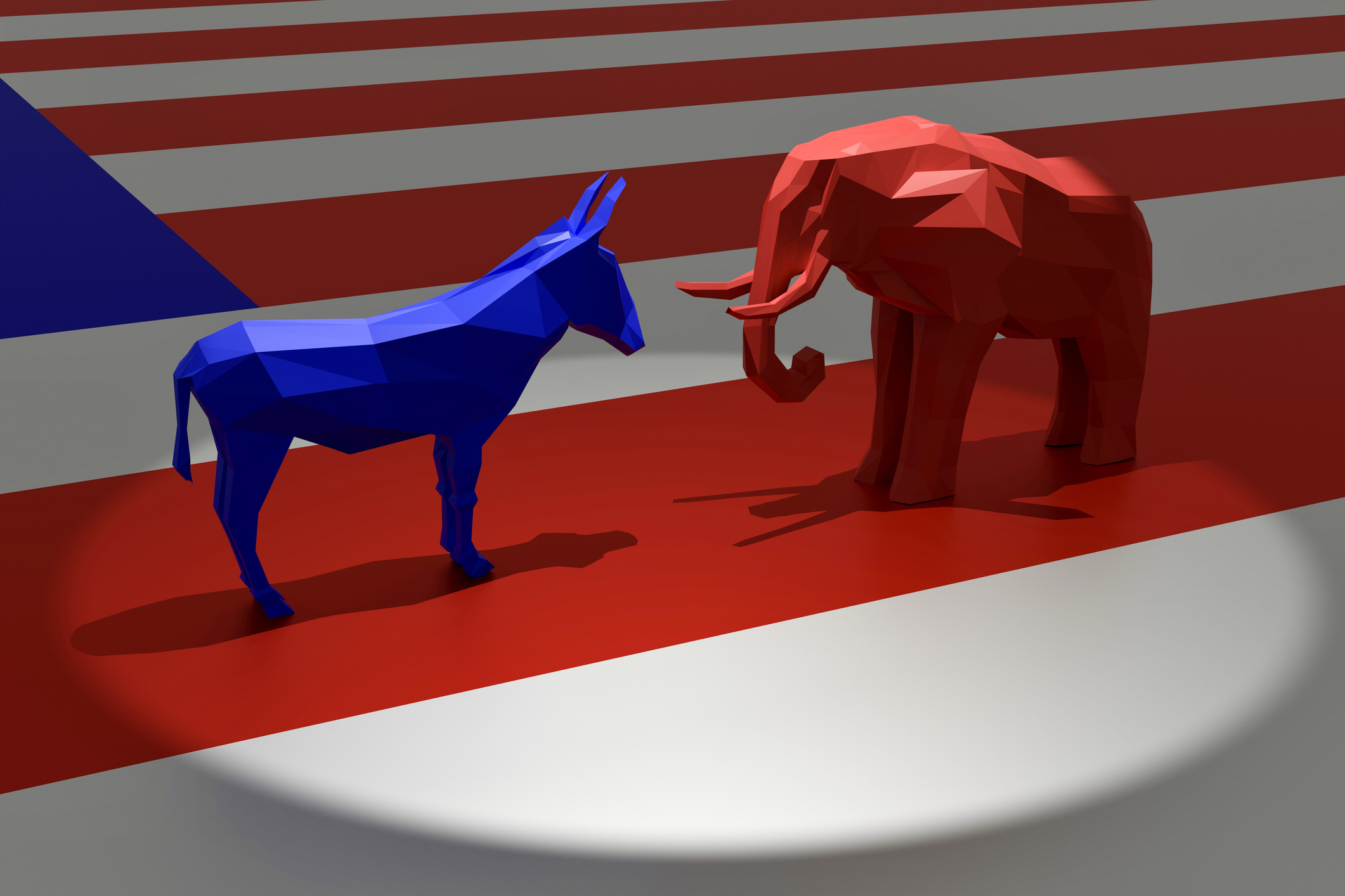 A blue donkey and a red elephant face each other on a stage with an American flag pattern