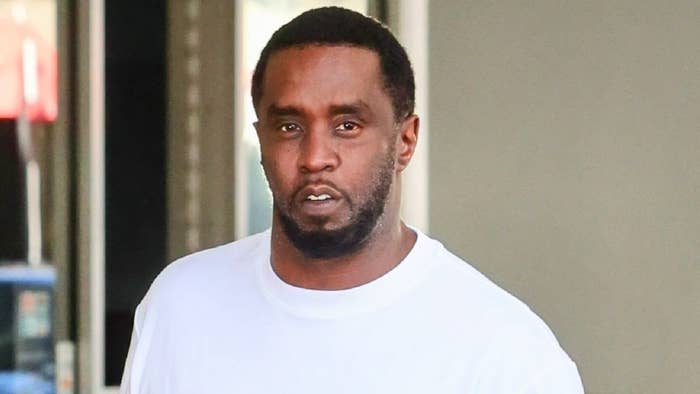 Sean &quot;Diddy&quot; Combs wearing a plain white t-shirt, looking towards the camera