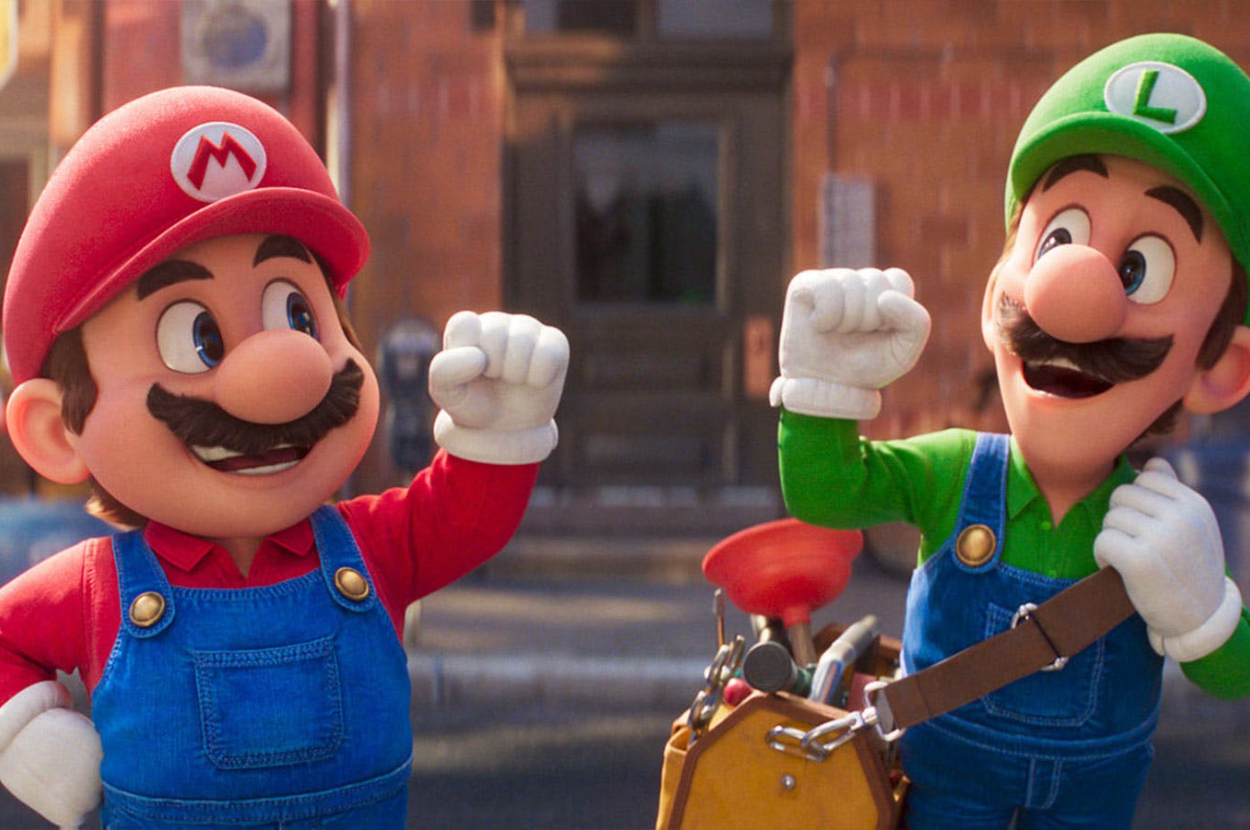 Mario and Luigi, characters from the Super Mario series, dressed in matching overalls with red and green shirts and hats, smile and gesture enthusiastically