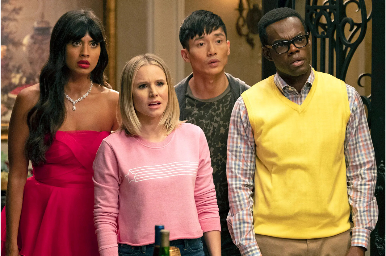 Jameela Jamil, Kristen Bell, Manny Jacinto, and William Jackson Harper appear surprised in a scene from "The Good Place."