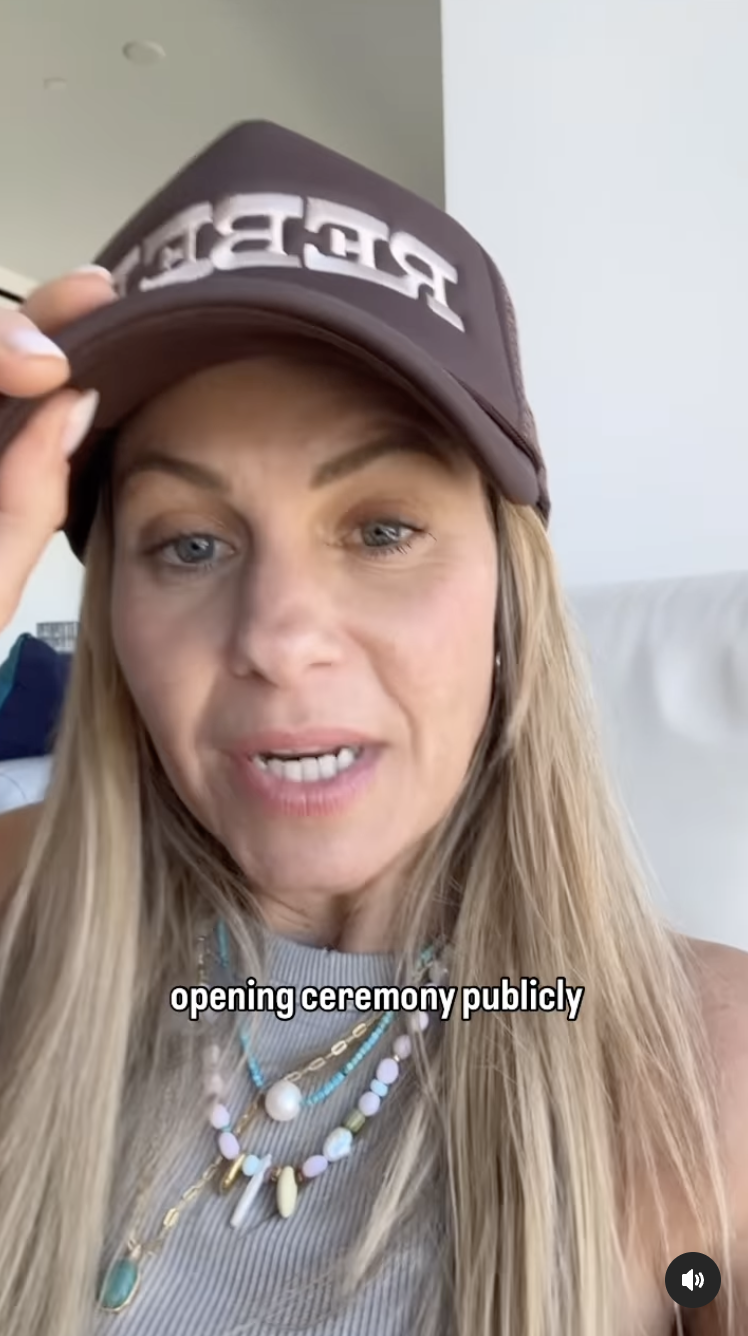 Candace Cameron Bure wears a cap and layered necklaces. Overlay text reads: "opening ceremony publicly."