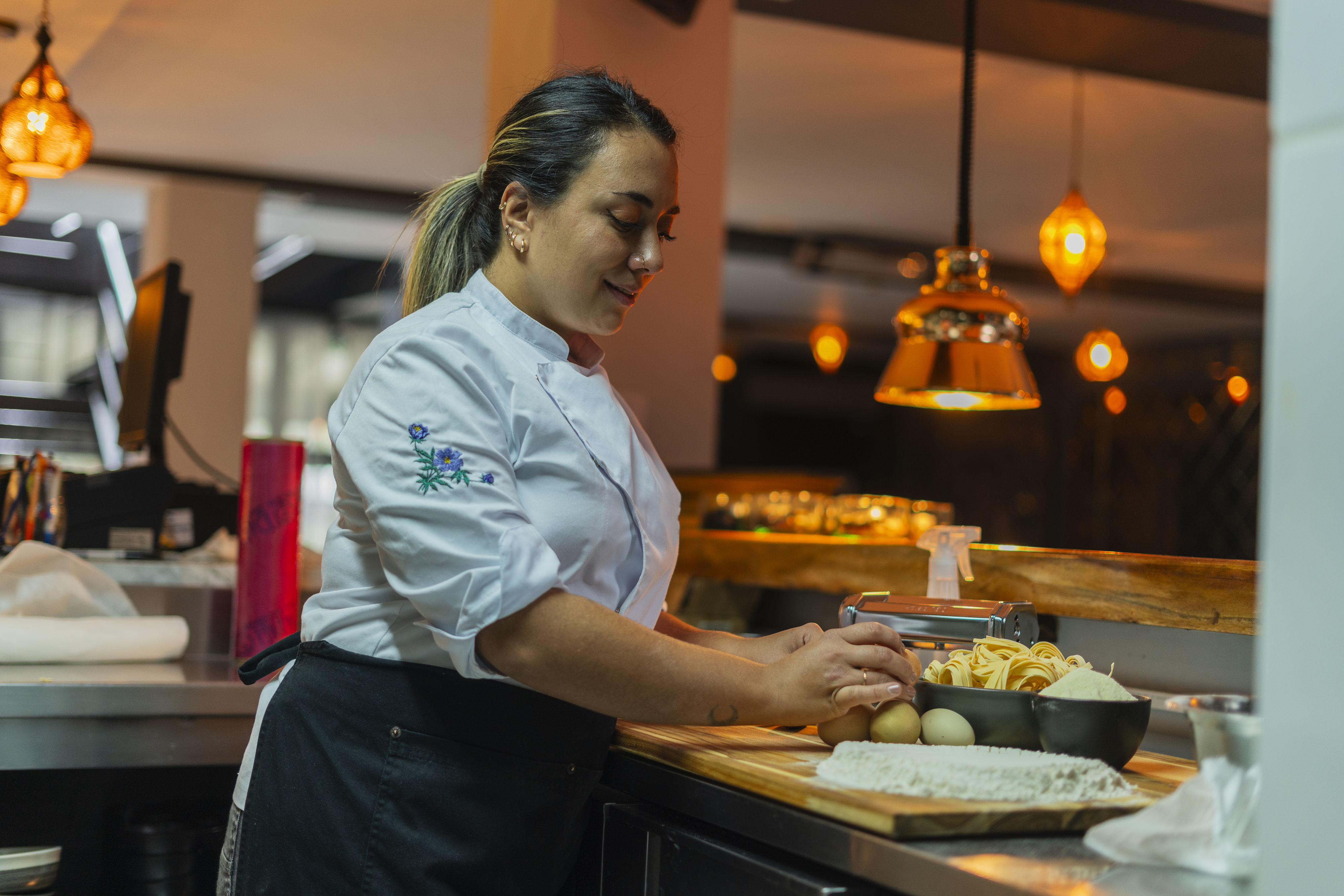 Chef in a professional kitchen preparing food.