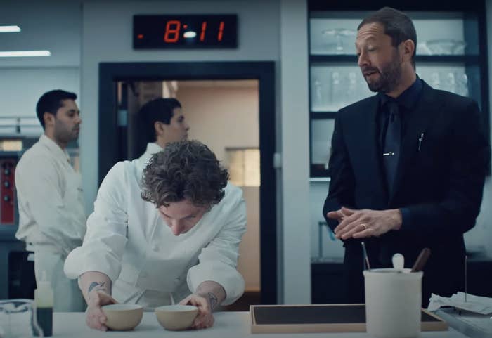 Ritchie and Carmy from "The Bear" season three looking serious in a fine-dining kitchen