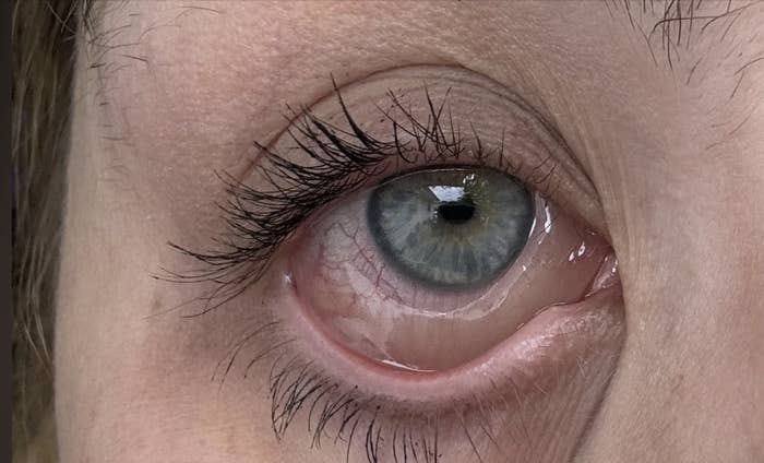 Close-up of a person's eye, capturing fine details of the eyelashes and iris. No other identifying features or context provided