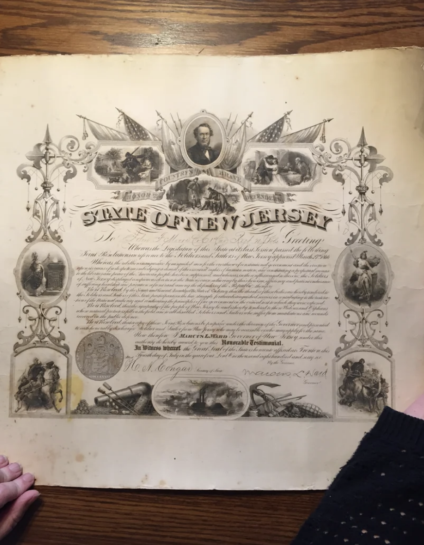 An ornate document from the State of New Jersey with historical illustrations and text. The document appears to be a certificate or proclamation