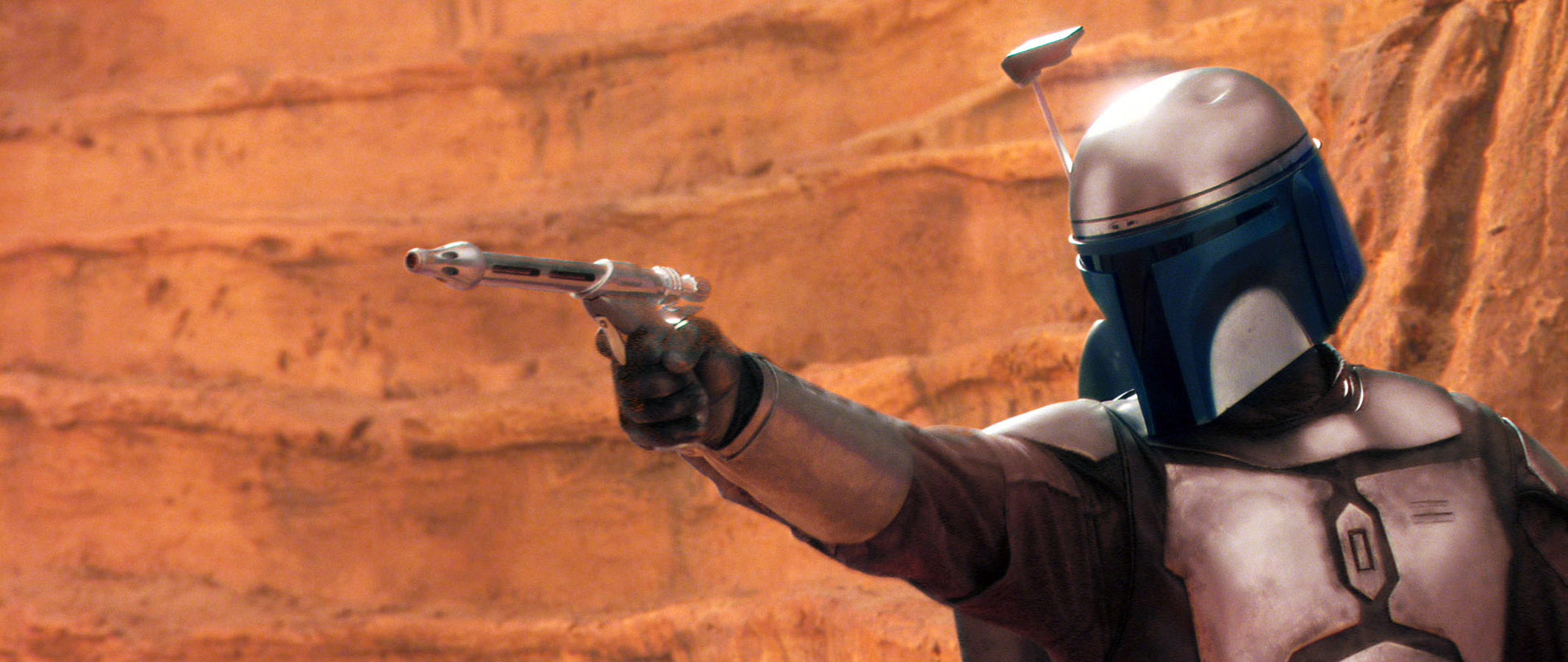 Jango Fett aims his blaster in a scene from the Star Wars film series