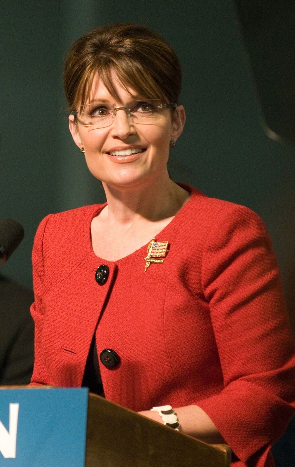 Sarah Palin speaks at a podium with a microphone