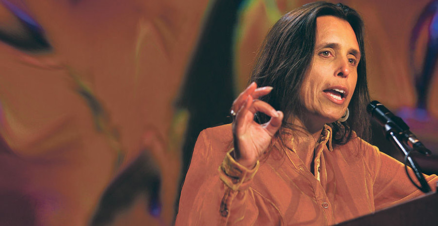 Winona LaDuke speaks at a podium