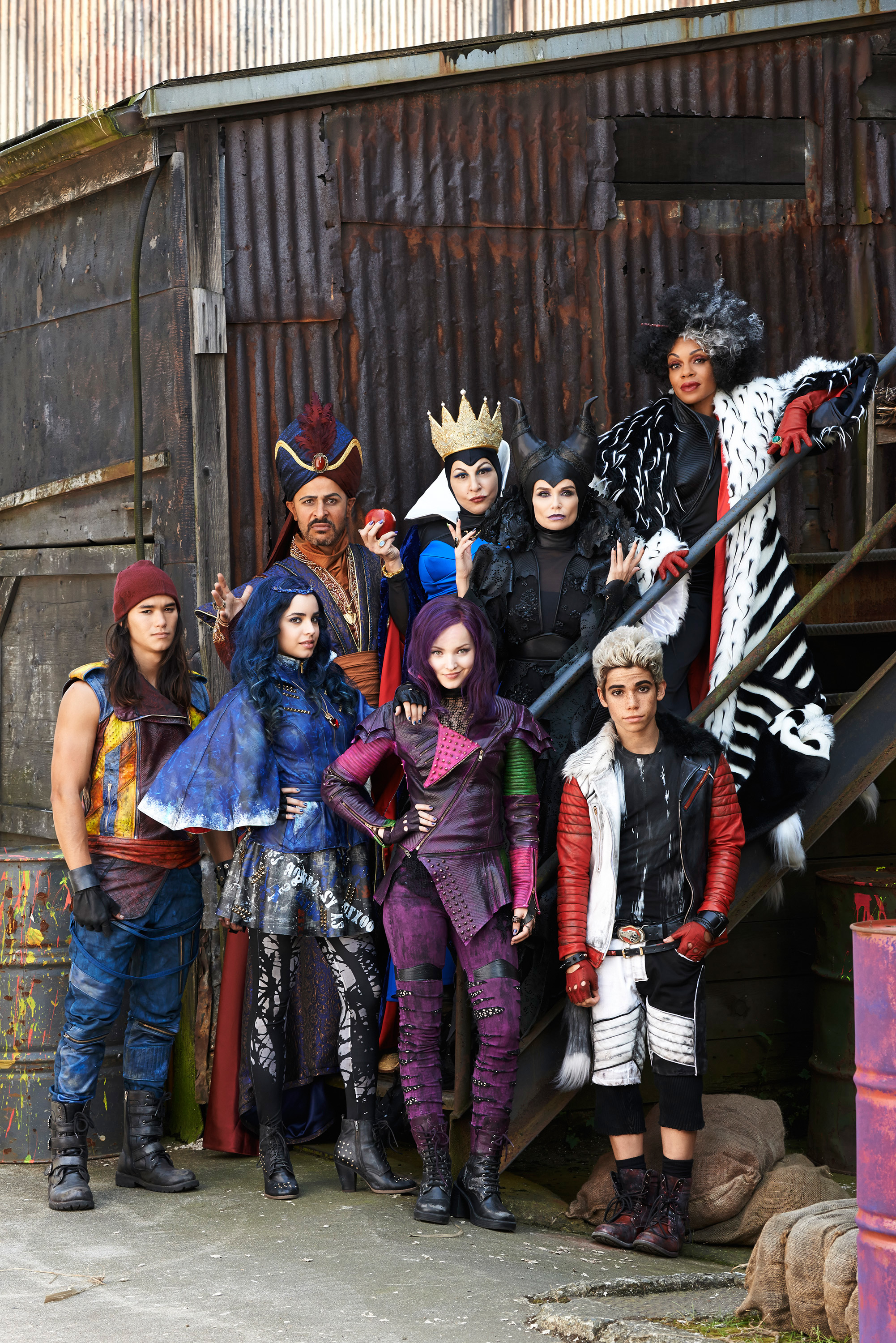 Cast of Disney's Descendants in character costumes: Dove Cameron, Cameron Boyce, Sofia Carson, Booboo Stewart, Mitchell Hope, Melanie Paxson, Kathy Najimy, and Kristin Chenoweth