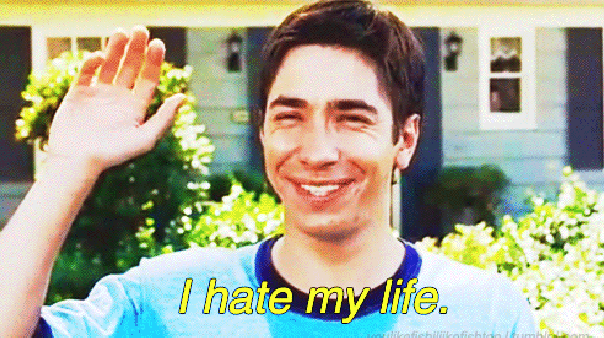 A smiling person waves with text overlay: "I hate my life."