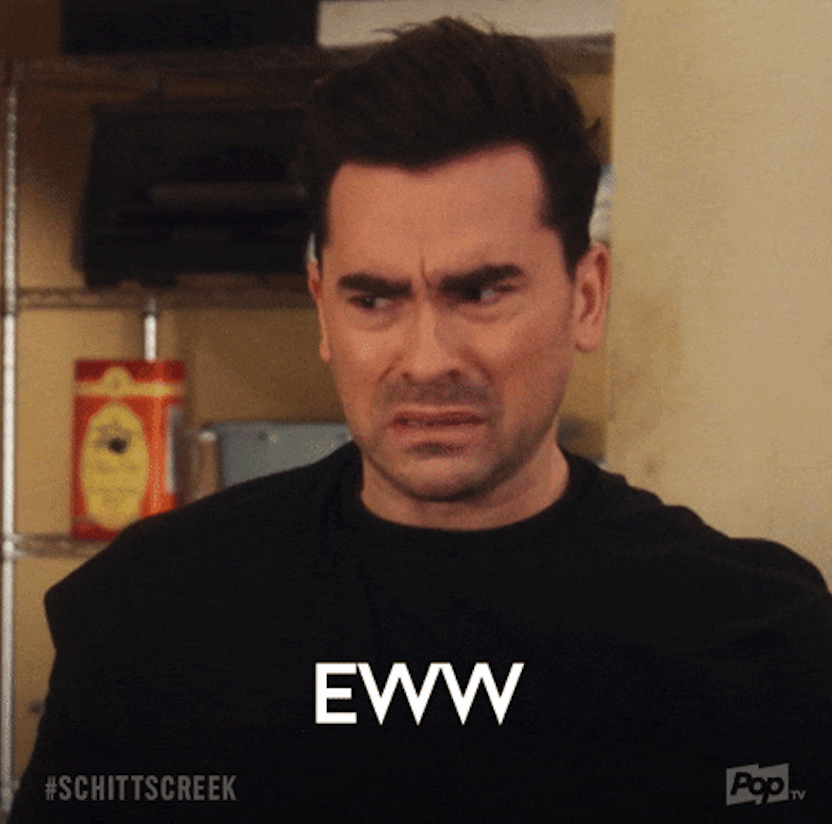 Dan Levy from Schitt's Creek makes an "eww" face, conveying disgust. Text on the image reads "EWW" and "#SCHITTSCREEK."
