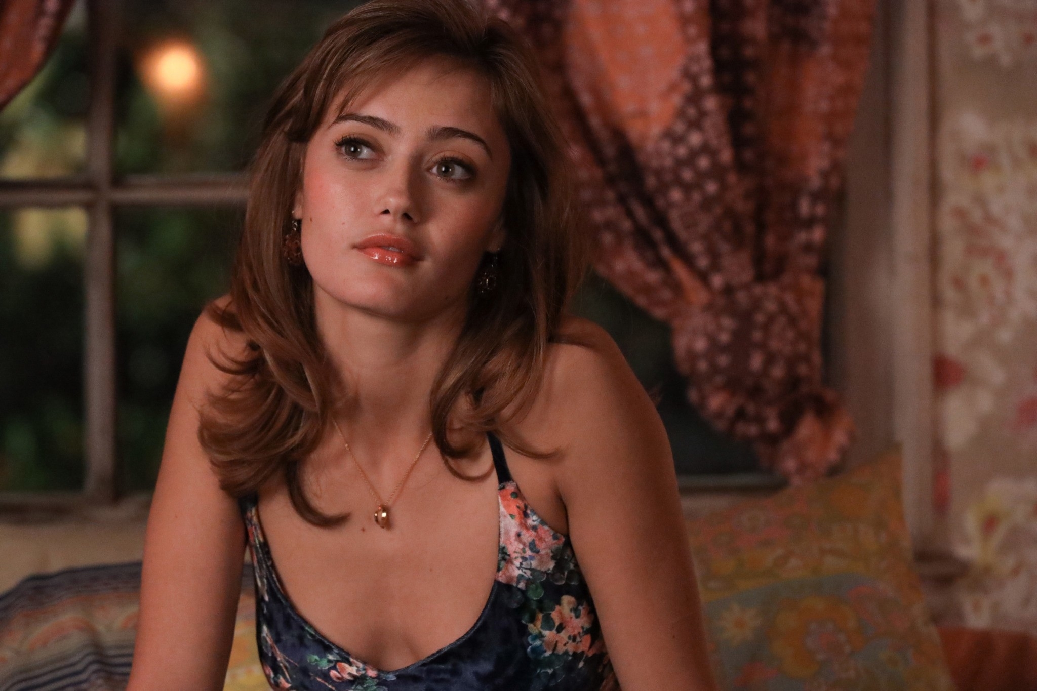 Ella Purnell wearing a floral tank top in a scene from "Yellowjackets"