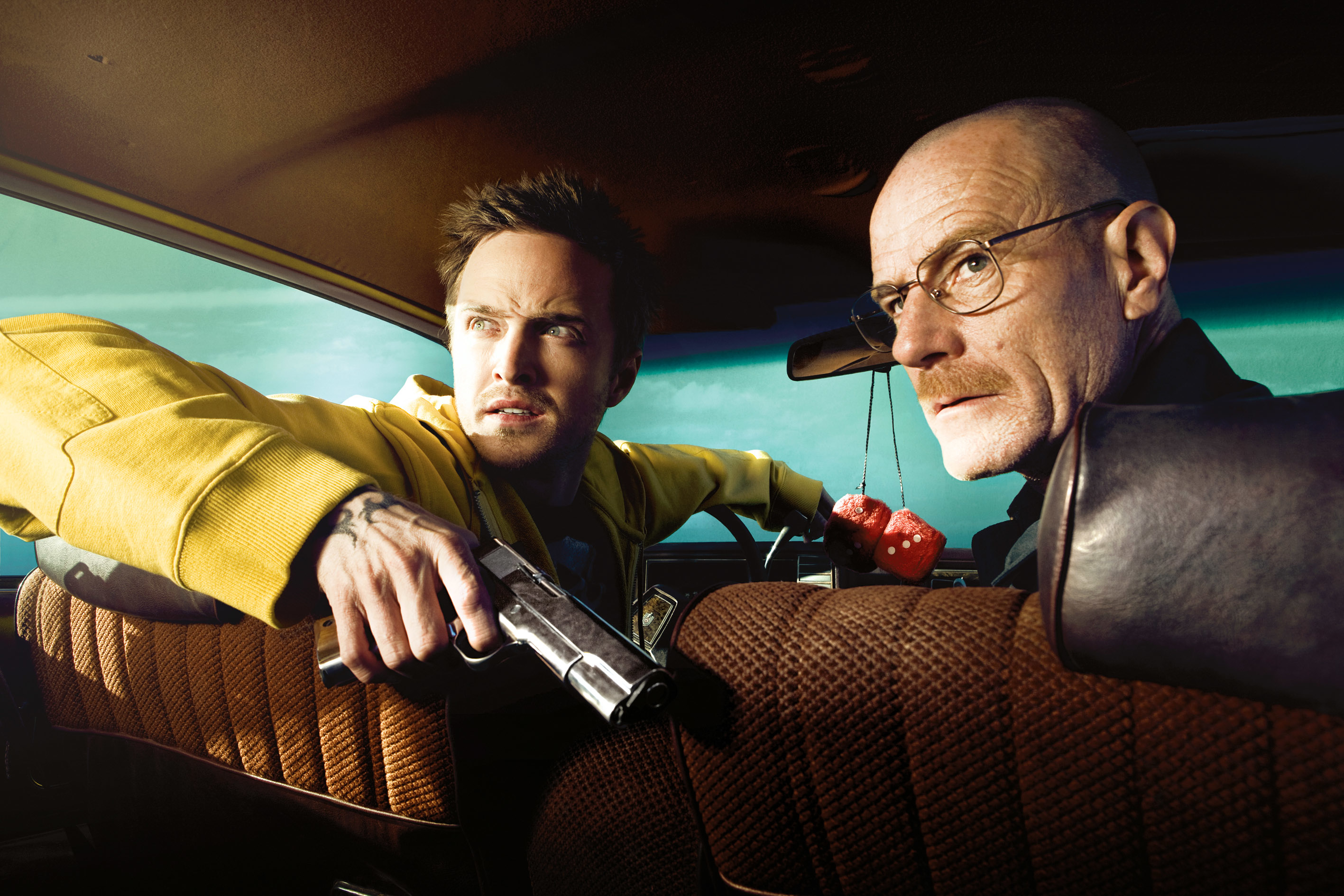Aaron Paul and Bryan Cranston sitting in a car in a scene from "Breaking Bad"
