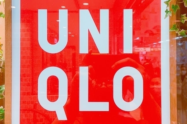 UNIQLO store sign framed with flowers and green leaves